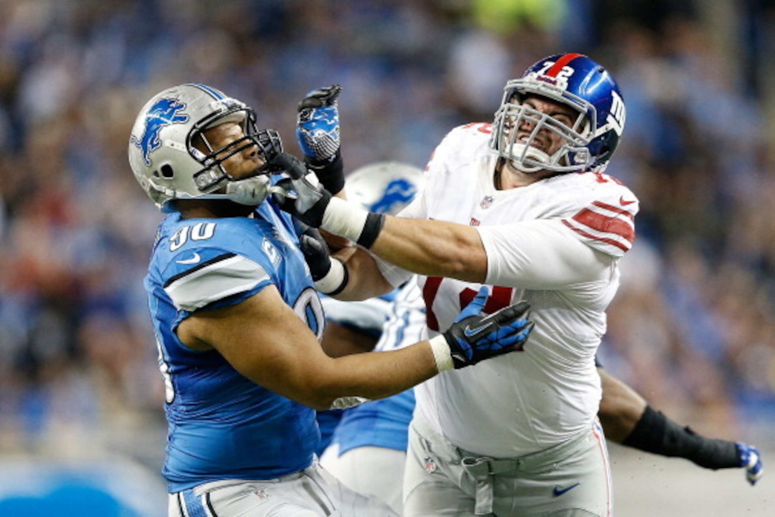 DETROIT, MI - DECEMBER 22: Ndamukong Suh #90 of the Detroit Lions and Justin Pugh #72 of the New York Giants battle during the second quarter of the game at Ford Field on December 22, 2013 in Detroit, Michigan. The Giants defeated the Lions 23-20 in overt