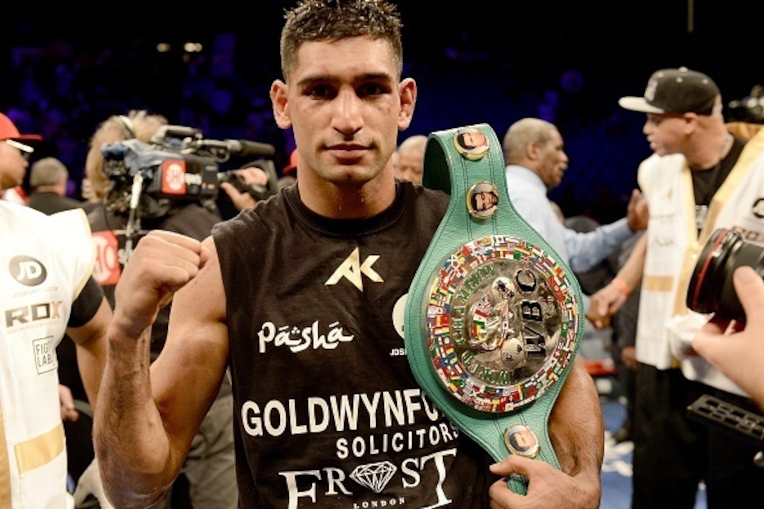 LAS VEGAS, NV-  DECEMBER 13:  Amir Khan celebrates his 12-round unanimous decision over Devon Alexander during their welterweight bout at the MGM Grand Garden Arena on December 13, 2014 in Las Vegas, Nevada. (Photo by Donald Miralle/Getty Images)