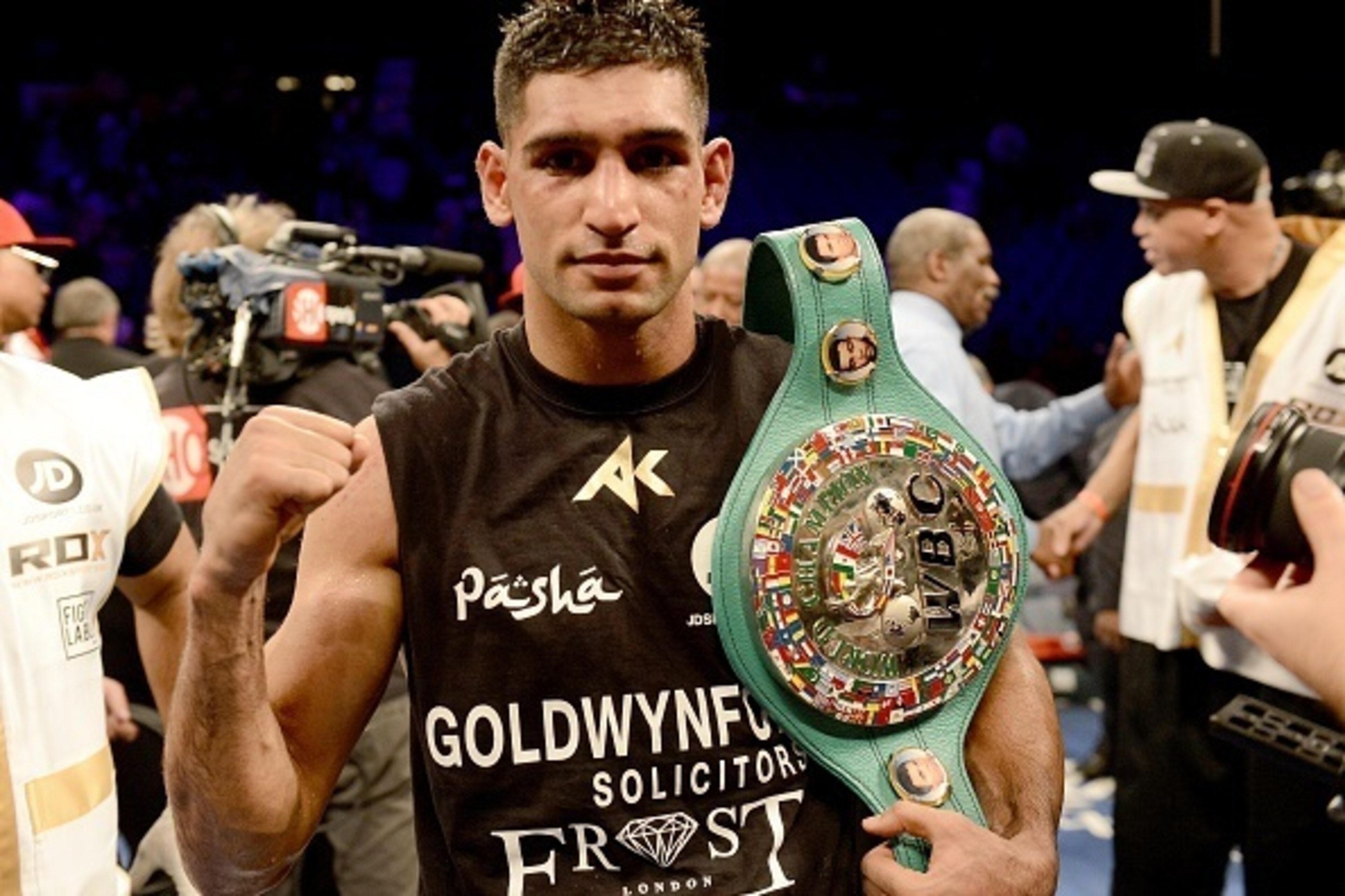 LAS VEGAS, NV-  DECEMBER 13:  Amir Khan celebrates his 12-round unanimous decision over Devon Alexander during their welterweight bout at the MGM Grand Garden Arena on December 13, 2014 in Las Vegas, Nevada. (Photo by Donald Miralle/Getty Images)