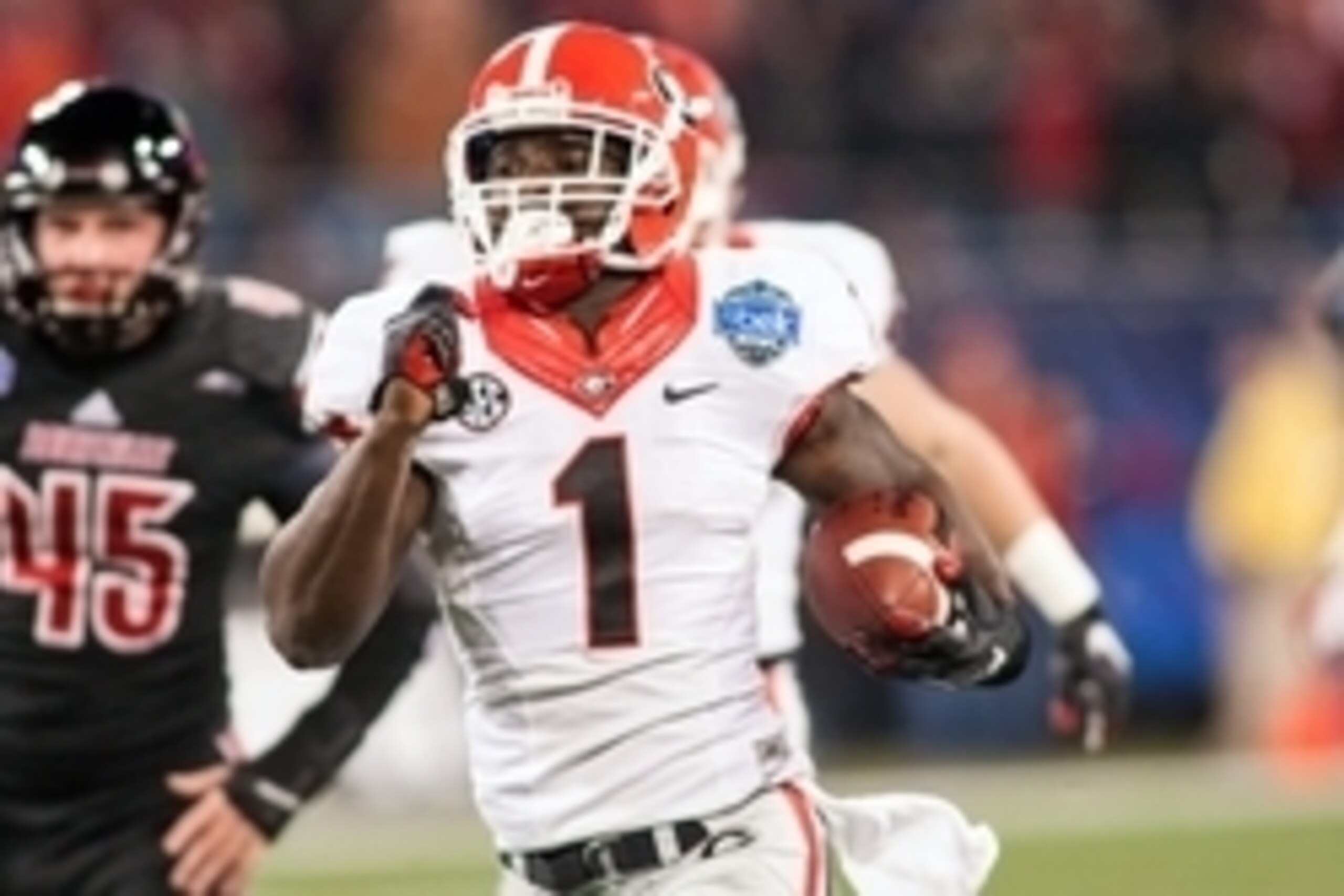 Dec 30, 2014; Charlotte, NC, USA; Georgia Bulldogs running back Sony Michel (1) returns a kick during the first quarter against the Louisville Cardinals in the Belk Bowl held at Bank of America Stadium. Mandatory Credit: Jeremy Brevard-USA TODAY Sports