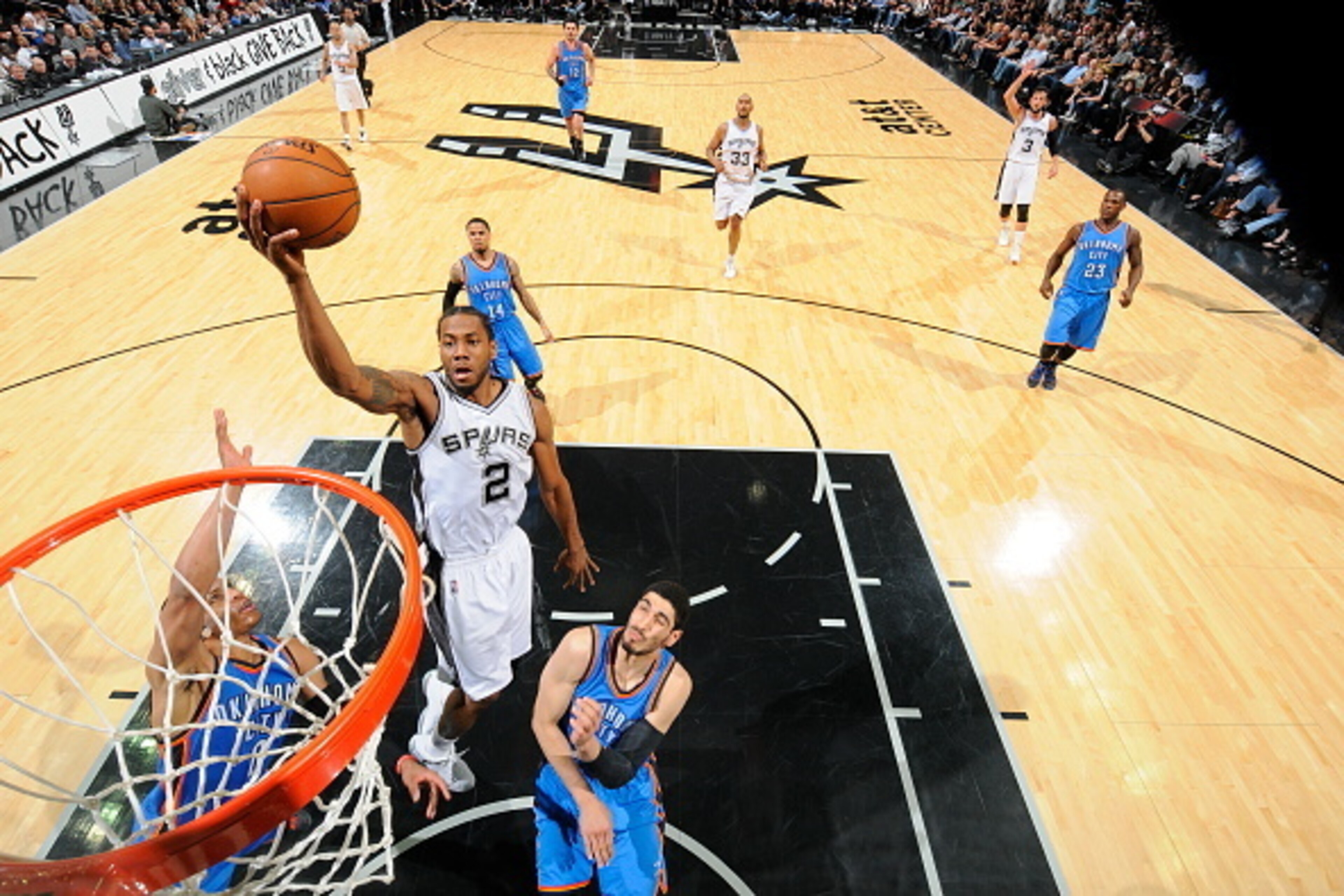 SAN ANTONIO - MARCH 25: Kawhi Leonard #2 of the San Antonio Spurs goes up for a shot against the Oklahoma City Thunder at the AT&T Center on March 25, 2014 in San Antonio, Texas. NOTE TO USER: User expressly acknowledges and agrees that, by downloading an SAN ANTONIO - MARCH 25: Kawhi Leonard #2 of the San Antonio Spurs goes up for a shot against the Oklahoma City Thunder at the AT&T Center on March 25, 2014 in San Antonio, Texas. NOTE TO USER: User expressly acknowledges and agrees that, by downloading an