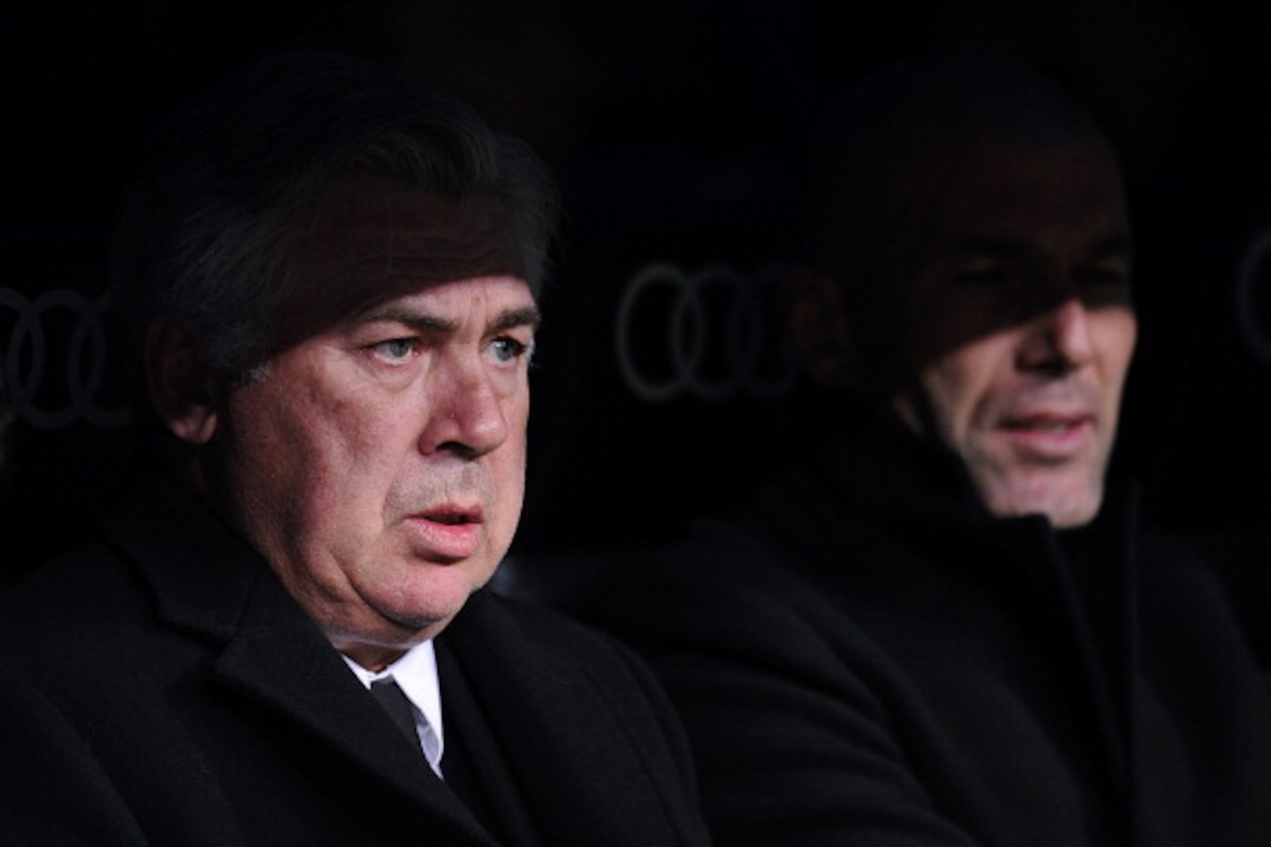 MADRID, SPAIN - DECEMBER 18:  Head coach Carlo Ancelotti (L) of Real Madrid looks on with assistant coach Zinedine Zidane during the start of the Copa del Rey, Round of 32 2nd leg match between Real Madrid and Olimpic de Xativa at Santiago Bernabeu stadiu