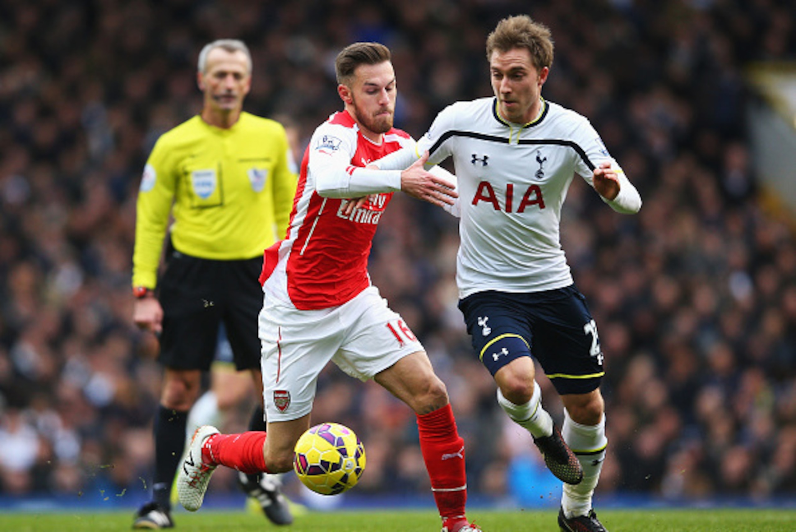 LONDON, ENGLAND - FEBRUARY 07: Christian Eriksen of Tottenham Hotspur is challenged by Aaron Ramsey of Arsenal during the Barclays Premier League match between Tottenham Hotspur and Arsenal at White Hart Lane on February 7, 2015 in London, England. (Pho LONDON, ENGLAND - FEBRUARY 07: Christian Eriksen of Tottenham Hotspur is challenged by Aaron Ramsey of Arsenal during the Barclays Premier League match between Tottenham Hotspur and Arsenal at White Hart Lane on February 7, 2015 in London, England. (Pho