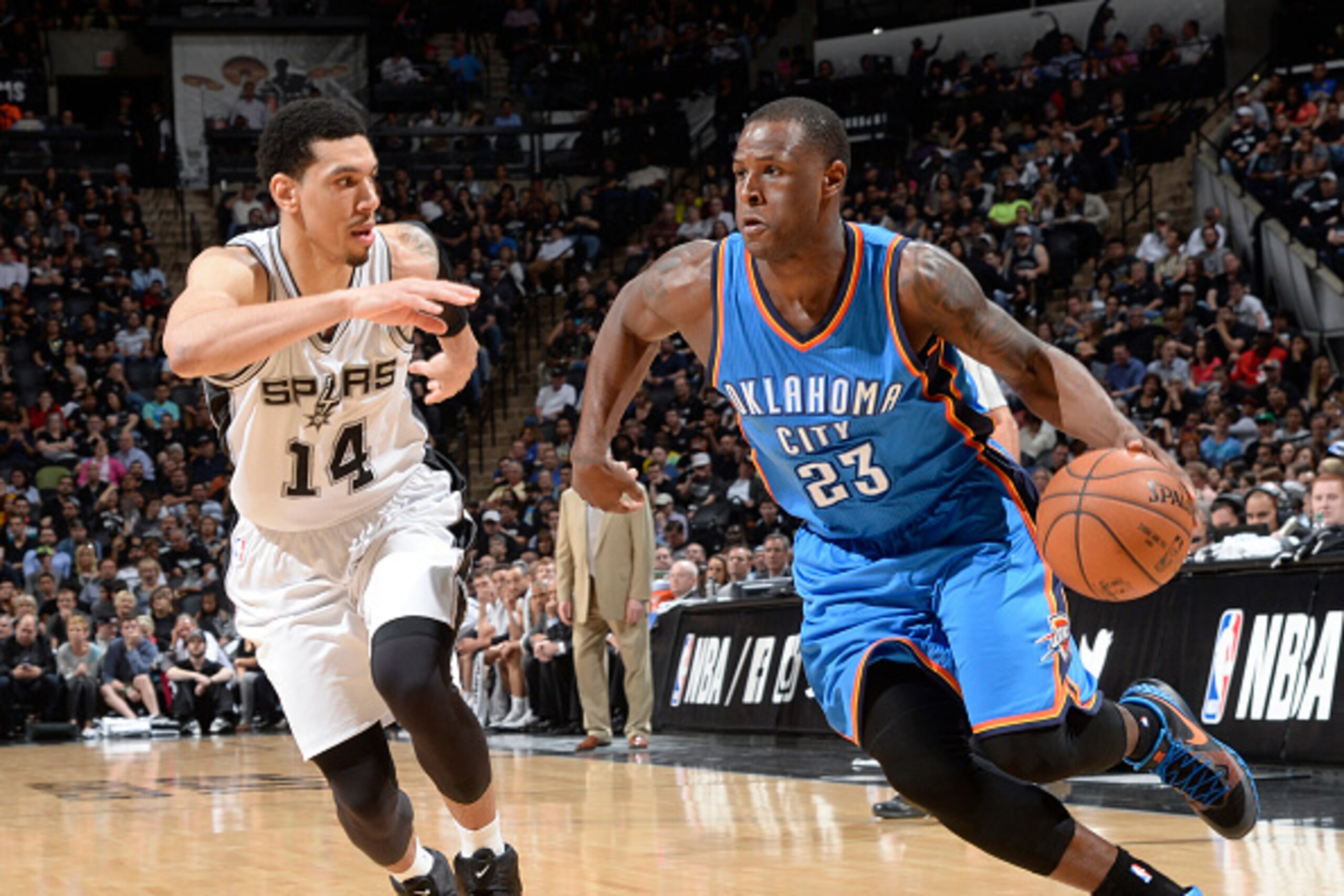 SAN ANTONIO - MARCH 25: Dion Waiters #23 of the Oklahoma City Thunder handles the ball against the San Antonio Spurs at the AT&T Center on March 25, 2014 in San Antonio, Texas. NOTE TO USER: User expressly acknowledges and agrees that, by downloading and 