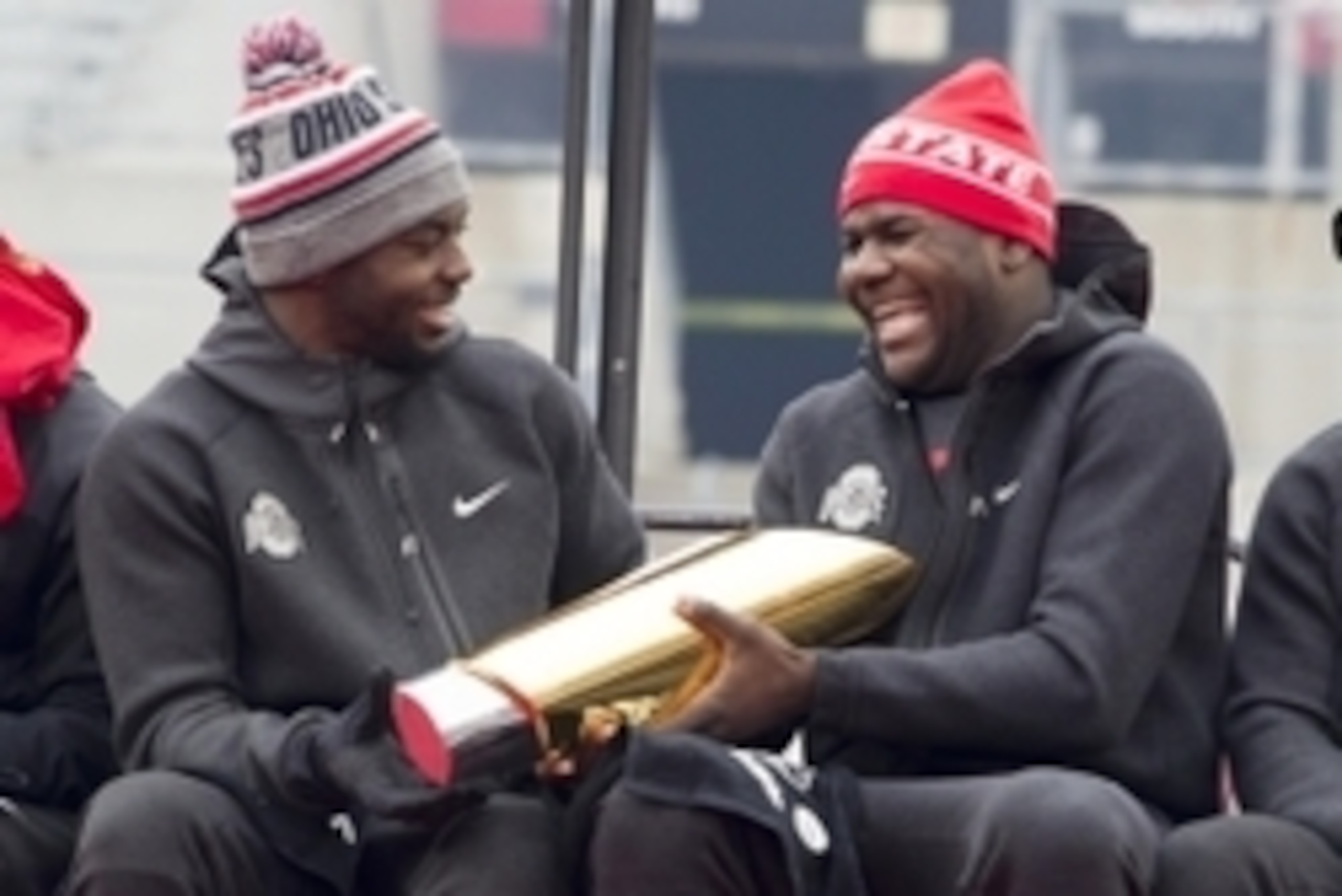 Jan 24, 2015; Columbus, OH, USA; Ohio State Buckeyes quarterback J.T. Barrett (16) hands the National Championship trophy to quarterback Cardale Jones (12) during the National Championship celebration at Ohio Stadium. Mandatory Credit: Greg Bartram-USA TO