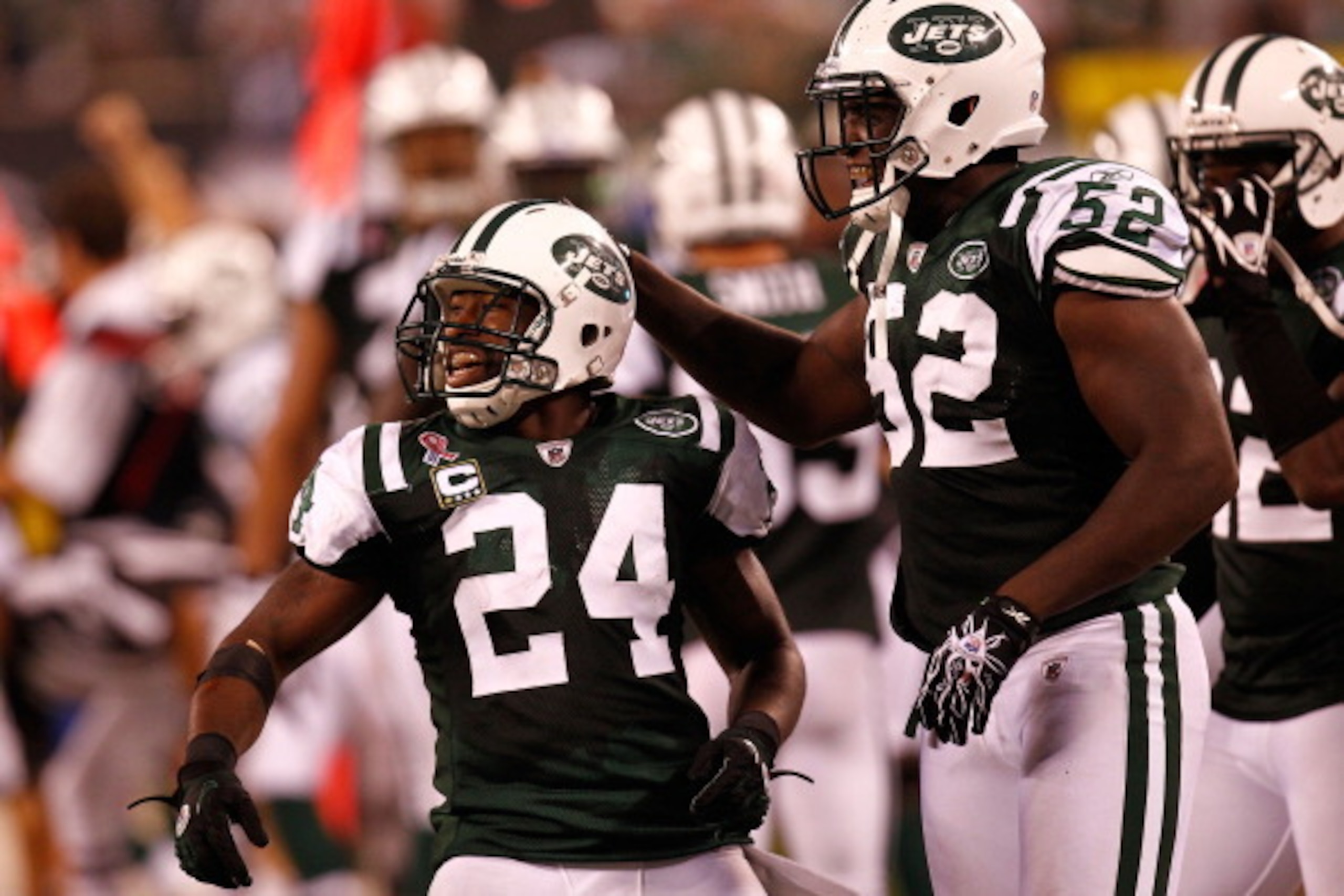 EAST RUTHERFORD, NJ - SEPTEMBER 11: Darrelle Revis #24 and David Harris #52 of the New York Jets celebrate after Revis intercepted a pass in the fourth quarter against the Dallas Cowboys during their NFL Season Opening Game at MetLife Stadium on Septembe EAST RUTHERFORD, NJ - SEPTEMBER 11: Darrelle Revis #24 and David Harris #52 of the New York Jets celebrate after Revis intercepted a pass in the fourth quarter against the Dallas Cowboys during their NFL Season Opening Game at MetLife Stadium on Septembe