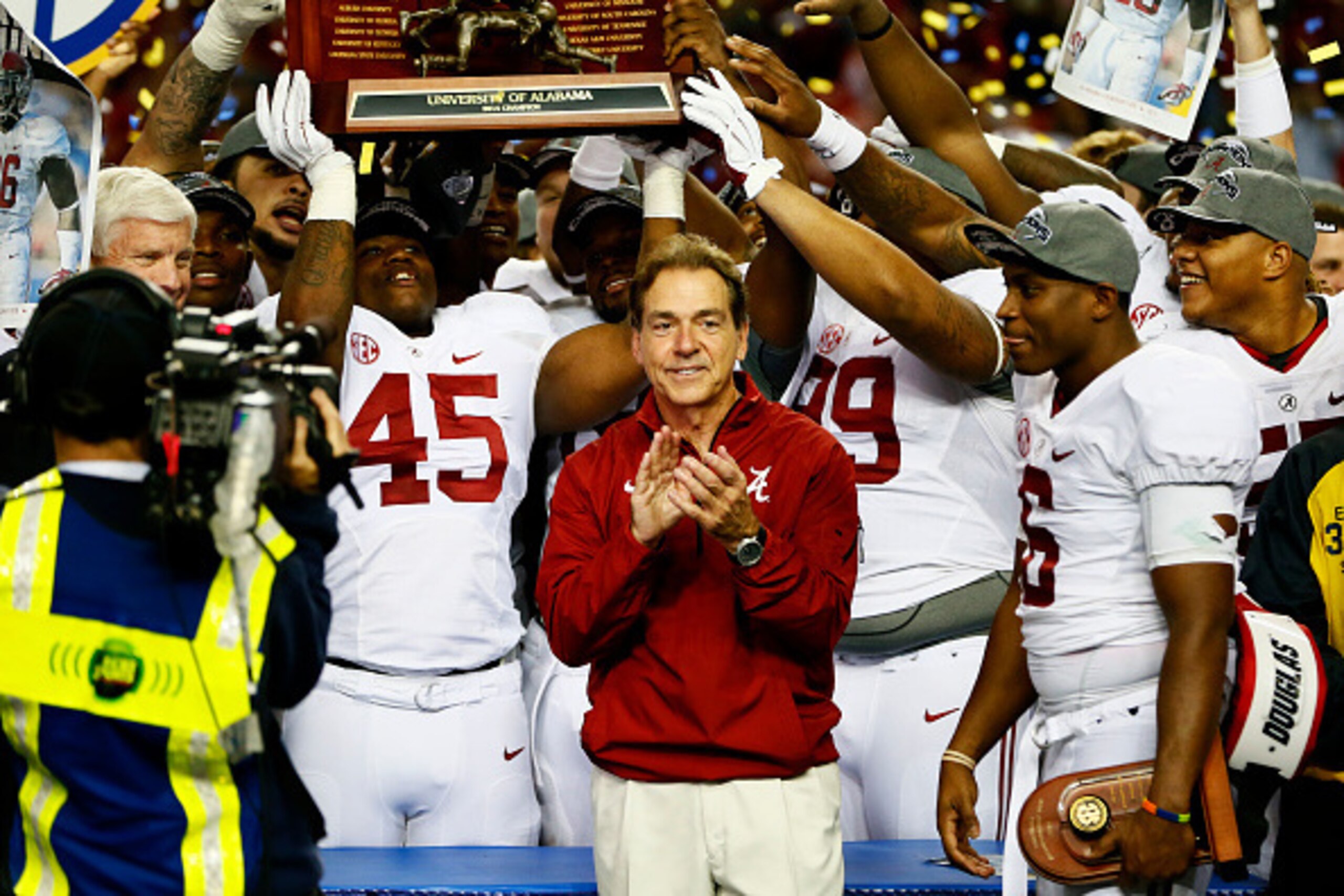 ATLANTA, GA - DECEMBER 06:  Head coach Nick Saban, Blake Sims #6 and the Alabama Crimson Tide celebrate their 42 to 13 win over the Missouri Tigers in the SEC Championship game at the Georgia Dome on December 6, 2014 in Atlanta, Georgia.  (Photo by Kevin 