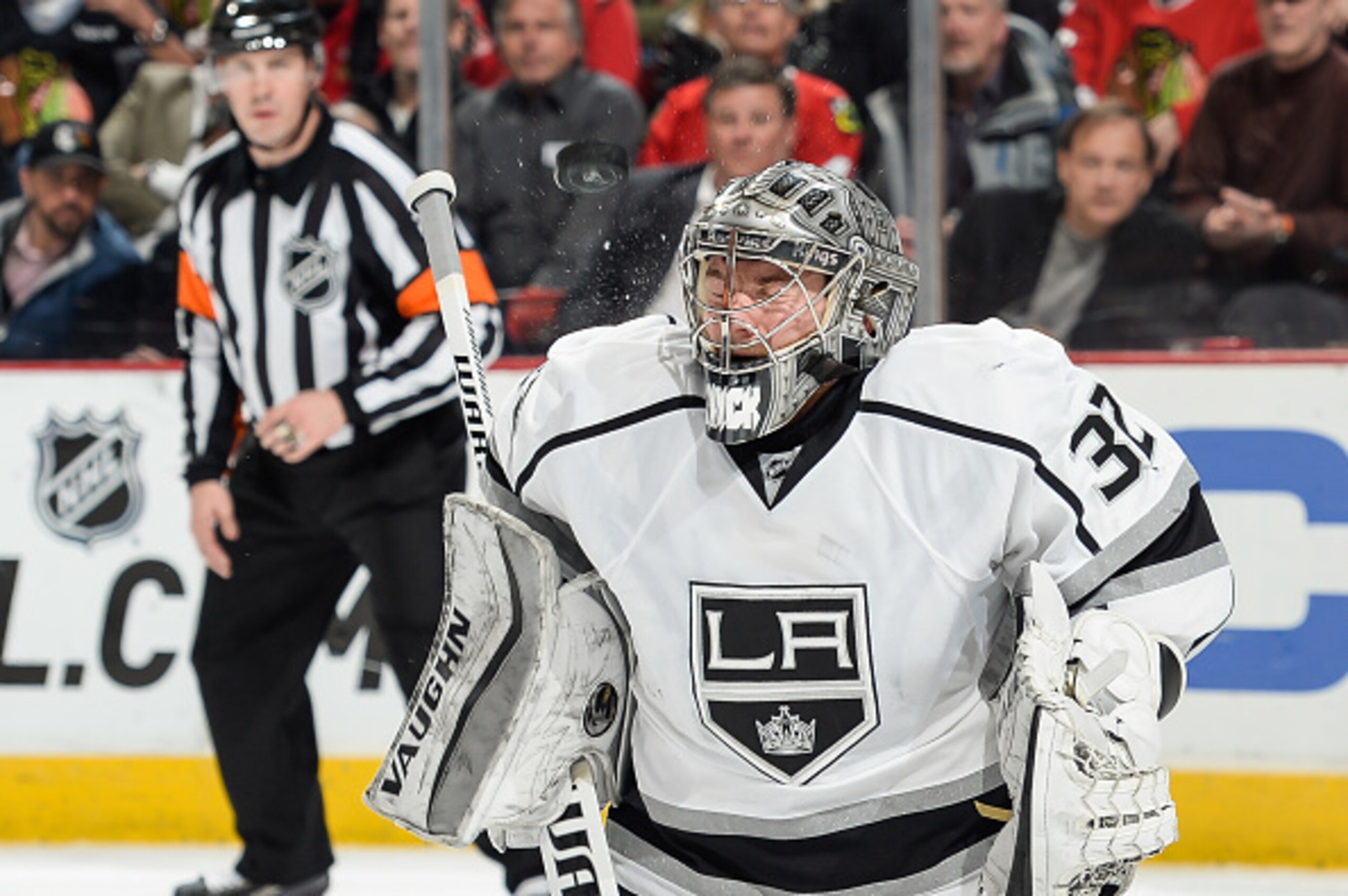 CHICAGO, IL - MARCH 30:  Goalie Jonathan Quick #32 of the Los Angeles Kings is hit by the puck during the NHL game against the Chicago Blackhawks at the United Center on March 30, 2015 in Chicago, Illinois.  (Photo by Bill Smith/NHLI via Getty Images)