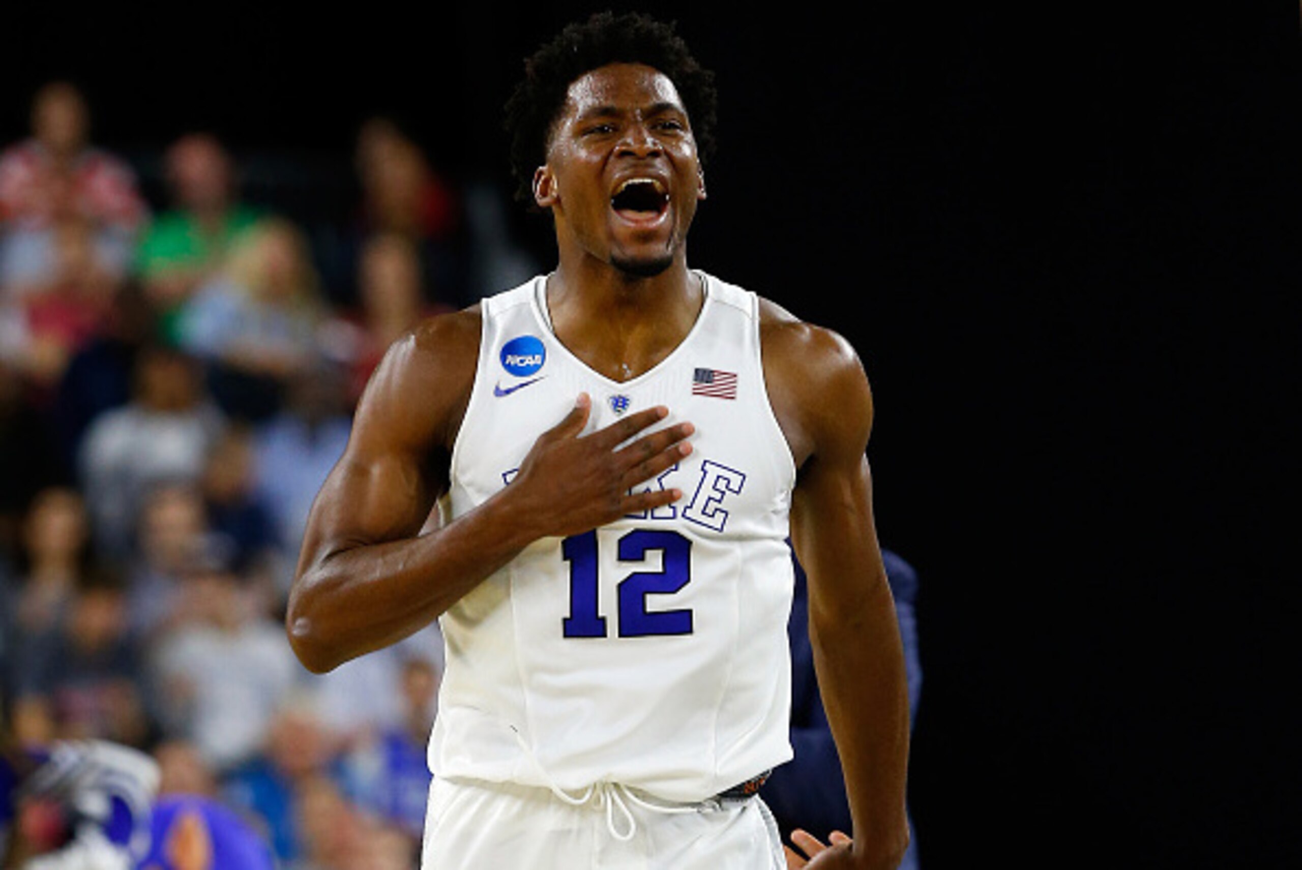 HOUSTON, TX - MARCH 27:  Justise Winslow #12 of the Duke Blue Devils reacts against the Utah Utes during a South Regional Semifinal game of the 2015 NCAA Men's Basketball Tournament at NRG Stadium on March 27, 2015 in Houston, Texas.  (Photo by Tom Pennin