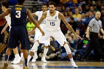 CLEVELAND, OH - MARCH 26: Willie Cauley-Stein #15 of the Kentucky Wildcats defends Juwan Staten #3 of the West Virginia Mountaineers in the second half during the Midwest Regional semifinal of the 2015 NCAA Men's Basketball Tournament at Quicken Loans Are