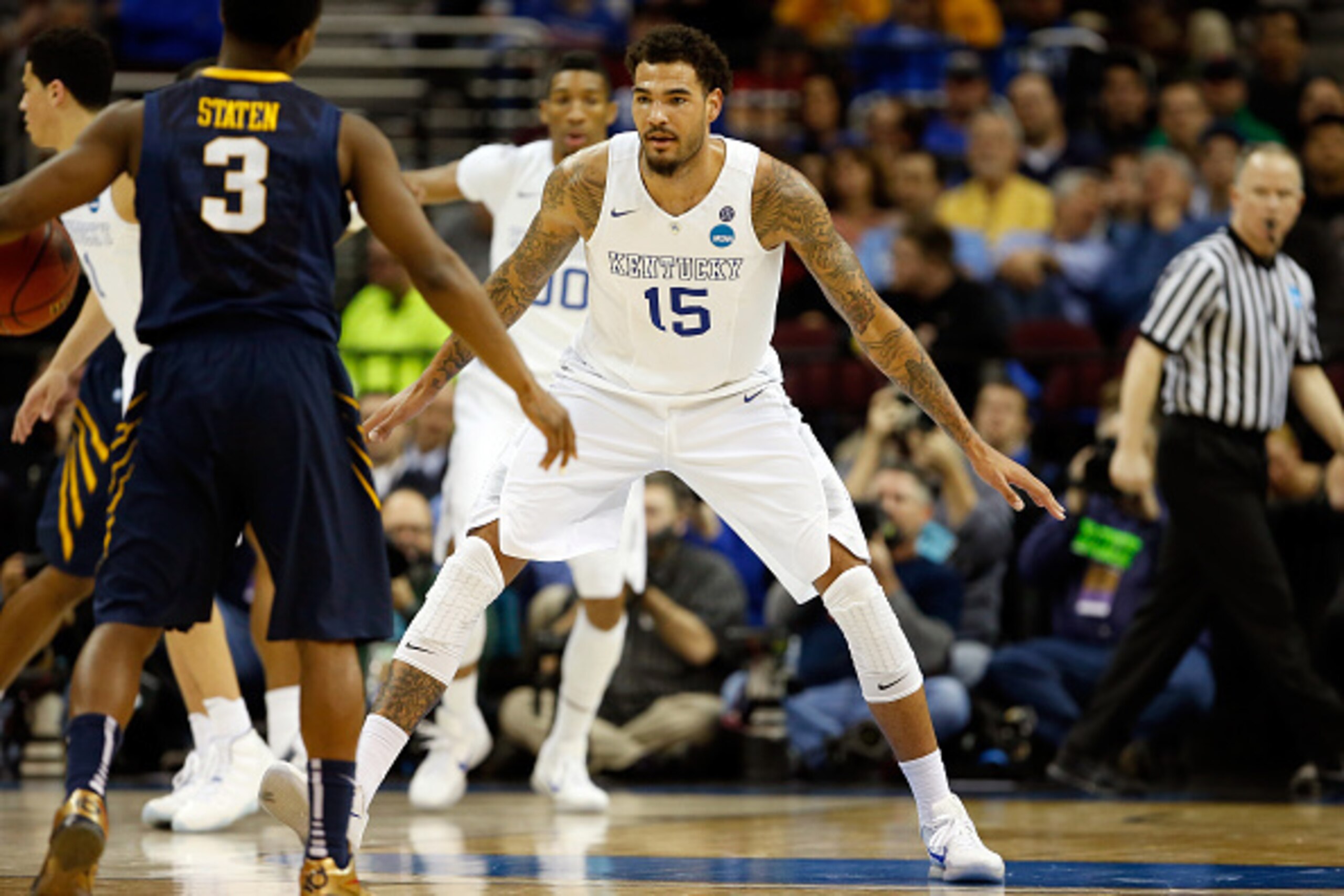 CLEVELAND, OH - MARCH 26: Willie Cauley-Stein #15 of the Kentucky Wildcats defends Juwan Staten #3 of the West Virginia Mountaineers in the second half during the Midwest Regional semifinal of the 2015 NCAA Men's Basketball Tournament at Quicken Loans Are