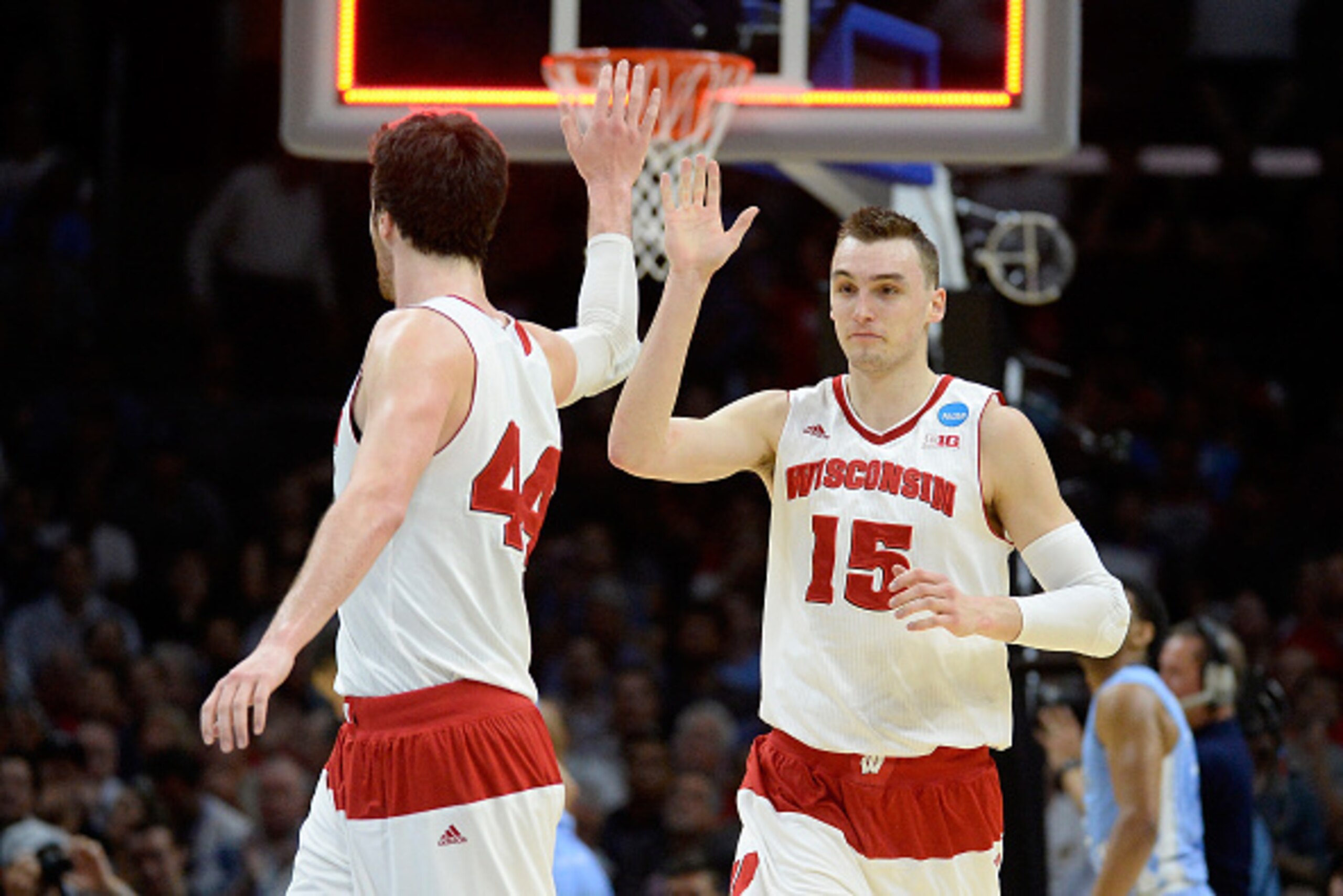 LOS ANGELES, CA - MARCH 26:  Sam Dekker #15 of the Wisconsin Badgers celebrates with Frank Kaminsky #44 after Dekker scores at the end of the first half against the North Carolina Tar Heels during the West Regional Semifinal of the 2015 NCAA Men's Basketb