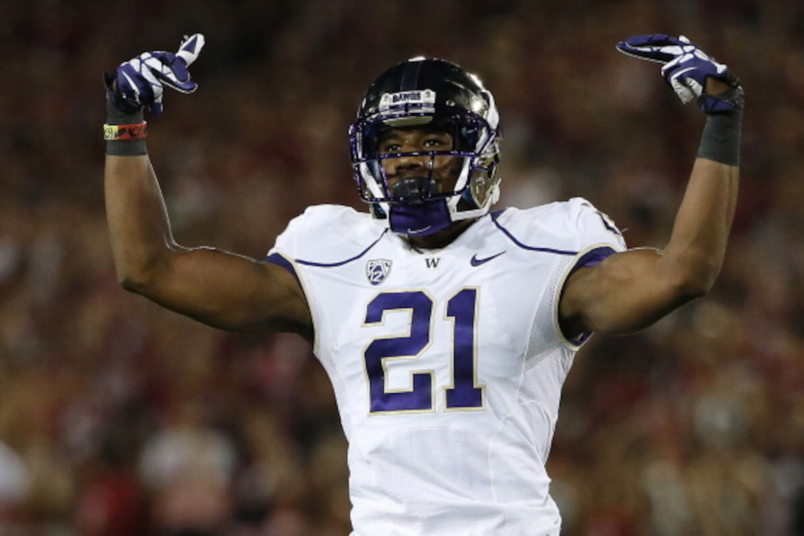 STANFORD, CA - OCTOBER 5: Defensive back Marcus Peters #21 of the the Washington Huskies gestures after intercepting a ball intended for wide receiver Michael Rector #3 of the Stanford Cardinal during the first quarter of their game on October 5, 2013 at 