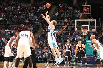 CHARLOTTE, NC - FEBRUARY 21:  Serge Ibaka #9 of the Oklahoma CIty Thunder goes for the tip off against Cody Zeller #40 of the Charlotte Hornets during the game at the Time Warner Cable Arena on February 21, 2015 in Charlotte, North Carolina. NOTE TO USER: