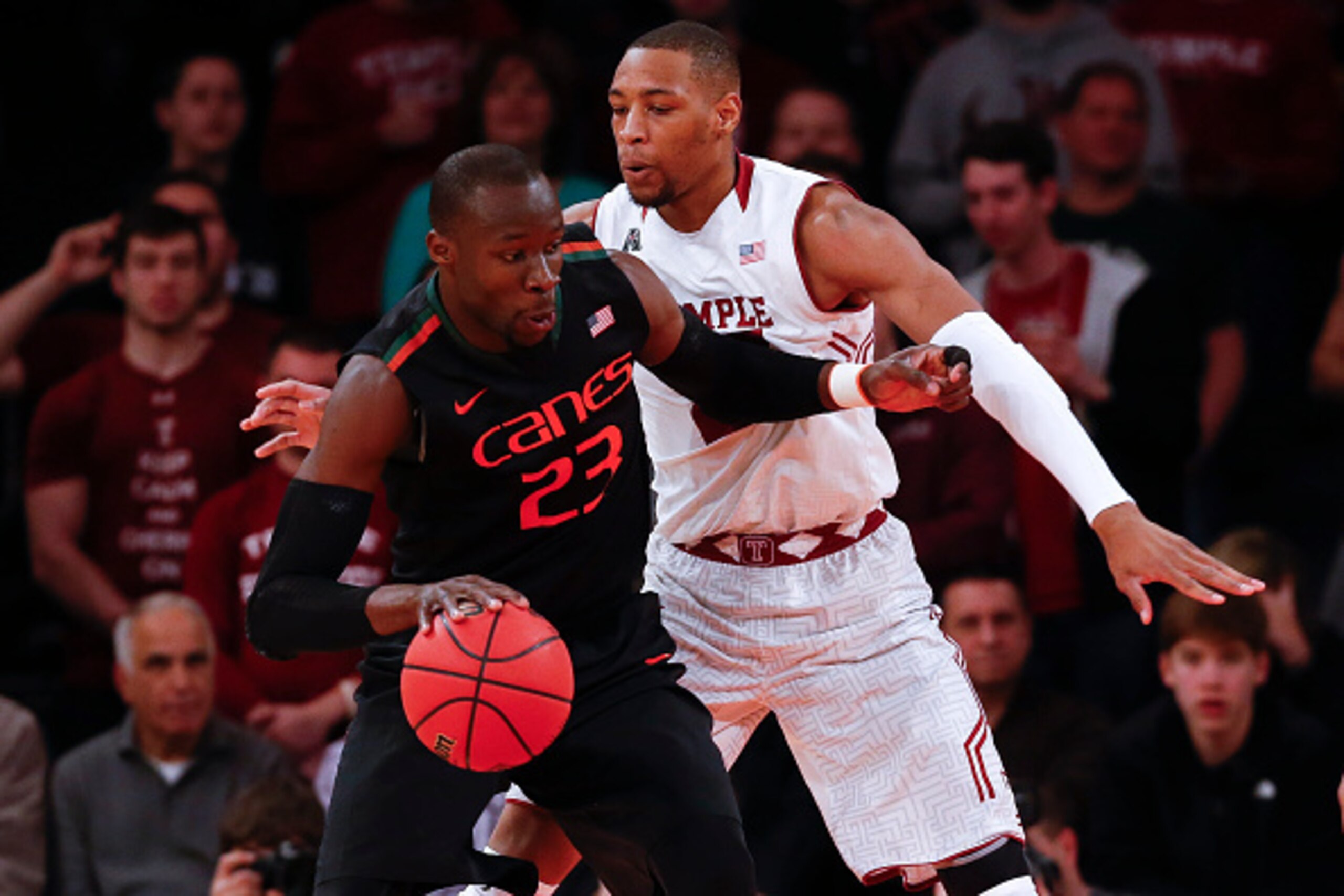 NEW YORK, NY - MARCH 31:  Devontae Watson #23 of the Temple Owls guards Tonye Jekiri #23 of the Miami (Fl) Hurricanes during the NIT Championship semifinals at Madison Square Garden on March 31, 2015 in New York City.  (Photo by Jeff Zelevansky/Getty Imag