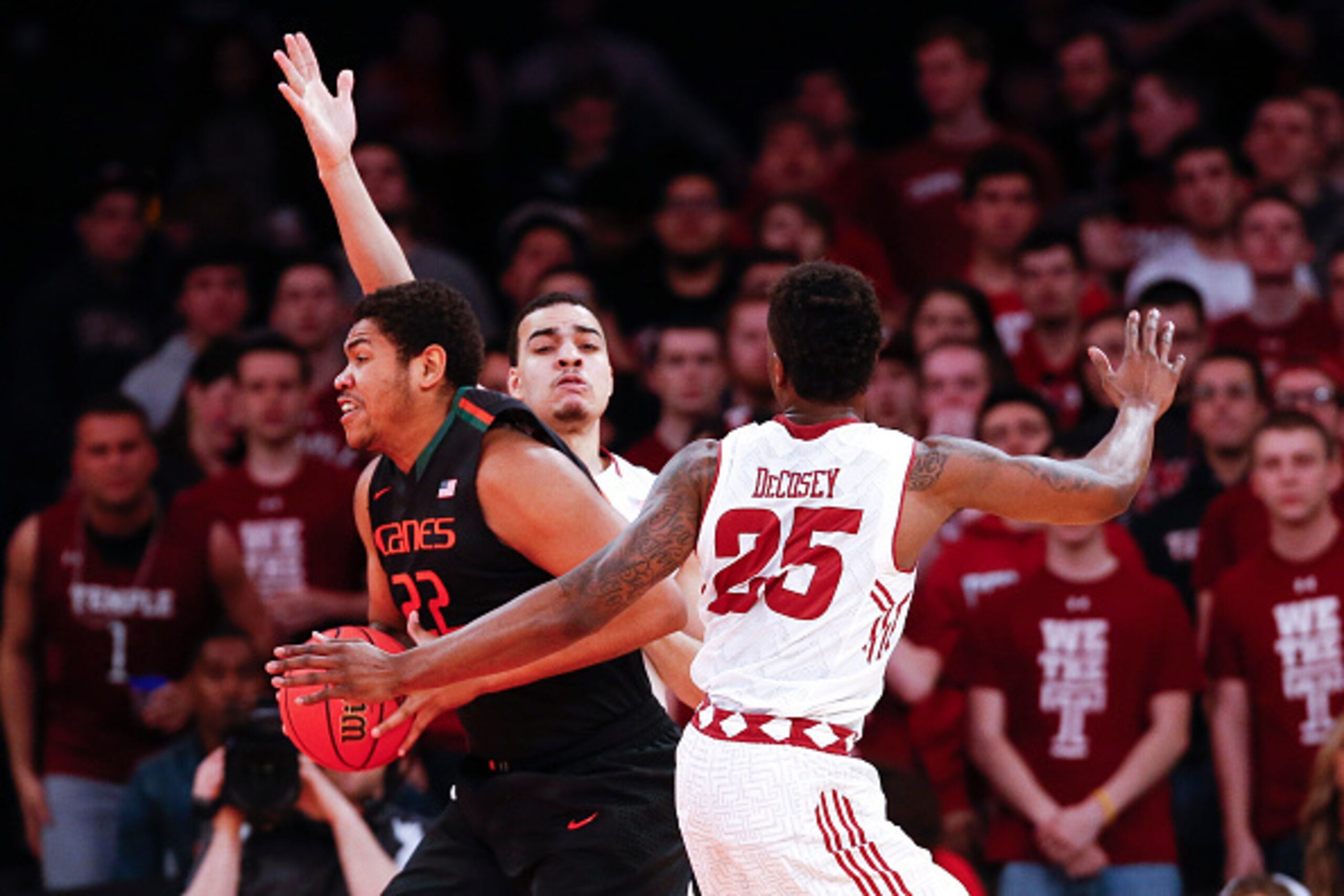 NEW YORK, NY - MARCH 31:  Will Cummings #2 and Quenton DeCosey #25 of the Temple Owls guard Omar Sherman #22 of the Miami (Fl) Hurricanes  during the NIT Championship semifinals at Madison Square Garden on March 31, 2015 in New York City.  (Photo by Jeff 