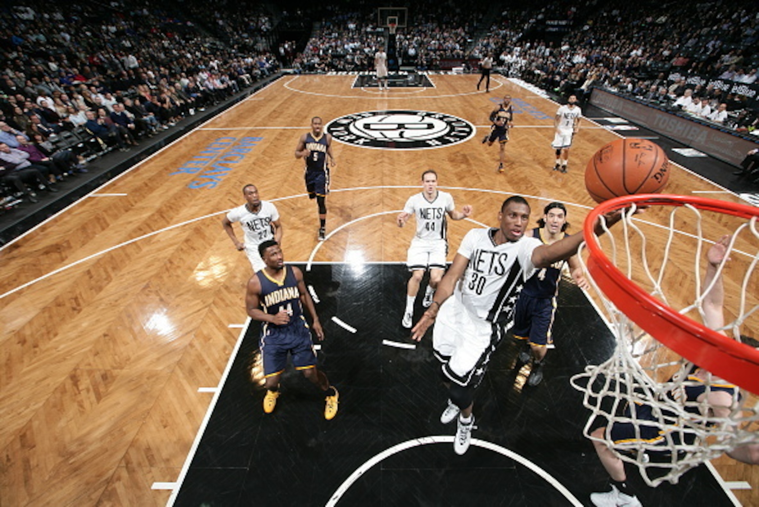 NEW YORK, NY - MARCH 31: Thaddeus Young #30 of the Brooklyn Nets shoots against the Indiana Pacers on March 31, 2015 at the Barclays Center in the Brooklyn borough of New York City. NOTE TO USER: User expressly acknowledges and agrees that, by downloading