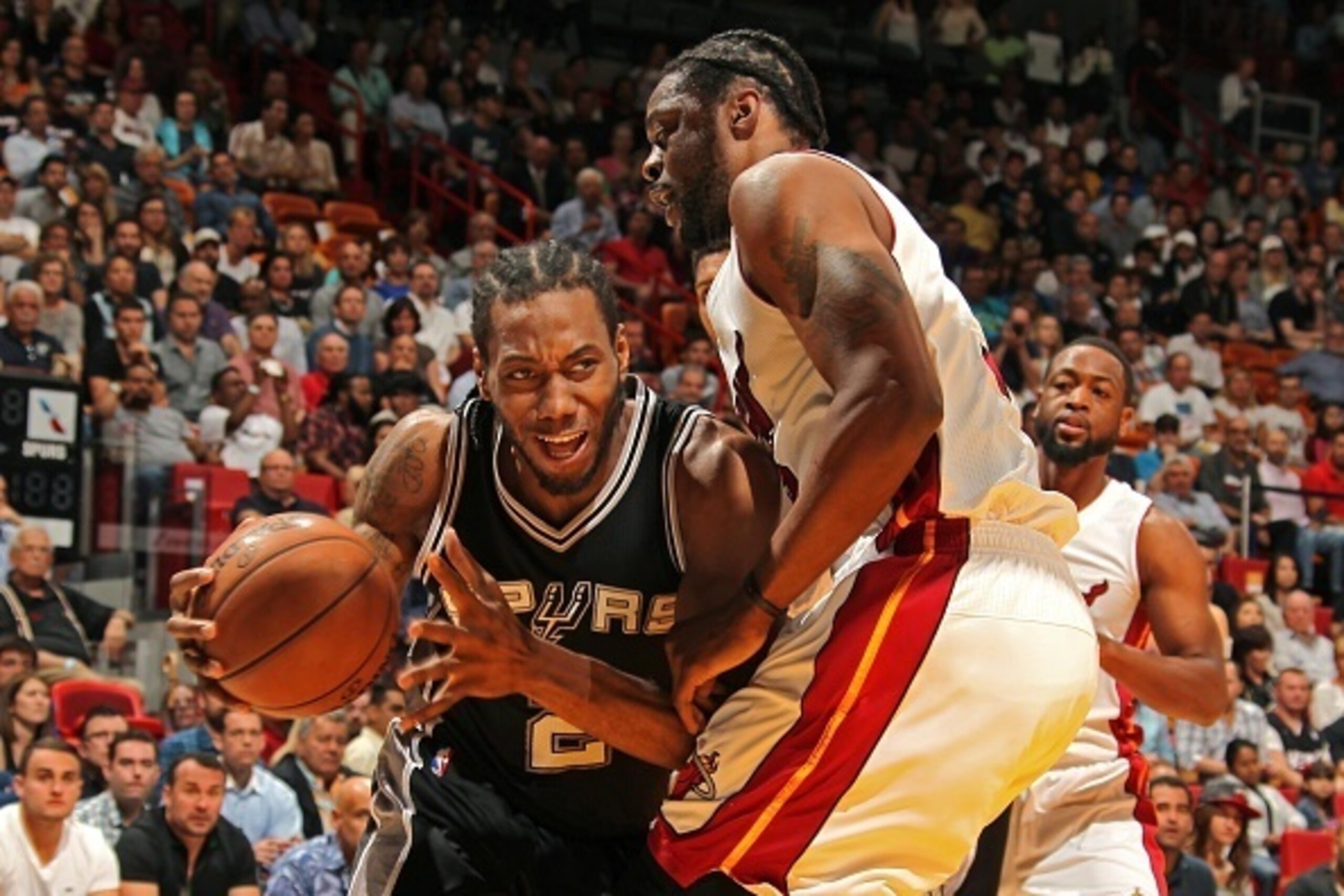 MIAMI, FL - MARCH 31:  Kawhi Leonard #2 of the San Antonio Spurs handles the ball against the Miami Heat on March 31, 2015 at American Airlines Arena in Miami, Florida.  NOTE TO USER: User expressly acknowledges and agrees that, by downloading and or usin