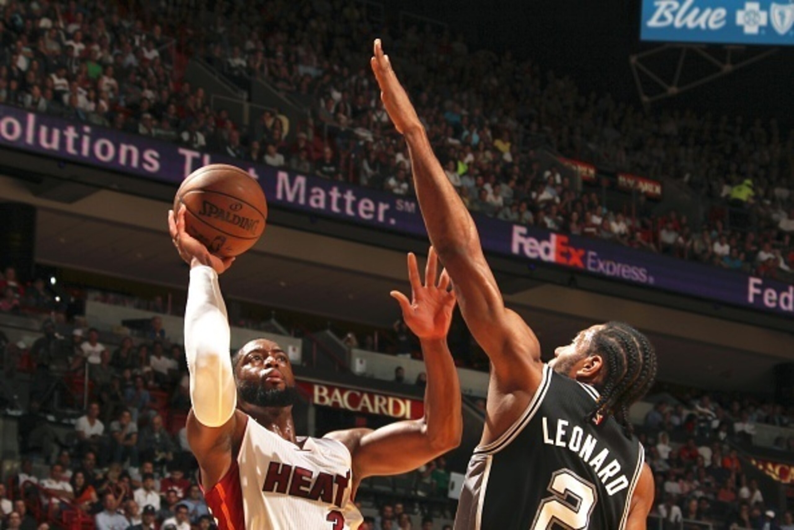 MIAMI, FL - MARCH 31:  Dwyane Wade #3 of the Miami Heat takes a shot against the San Antonio Spurs on March 31, 2015 at American Airlines Arena in Miami, Florida.  NOTE TO USER: User expressly acknowledges and agrees that, by downloading and or using this