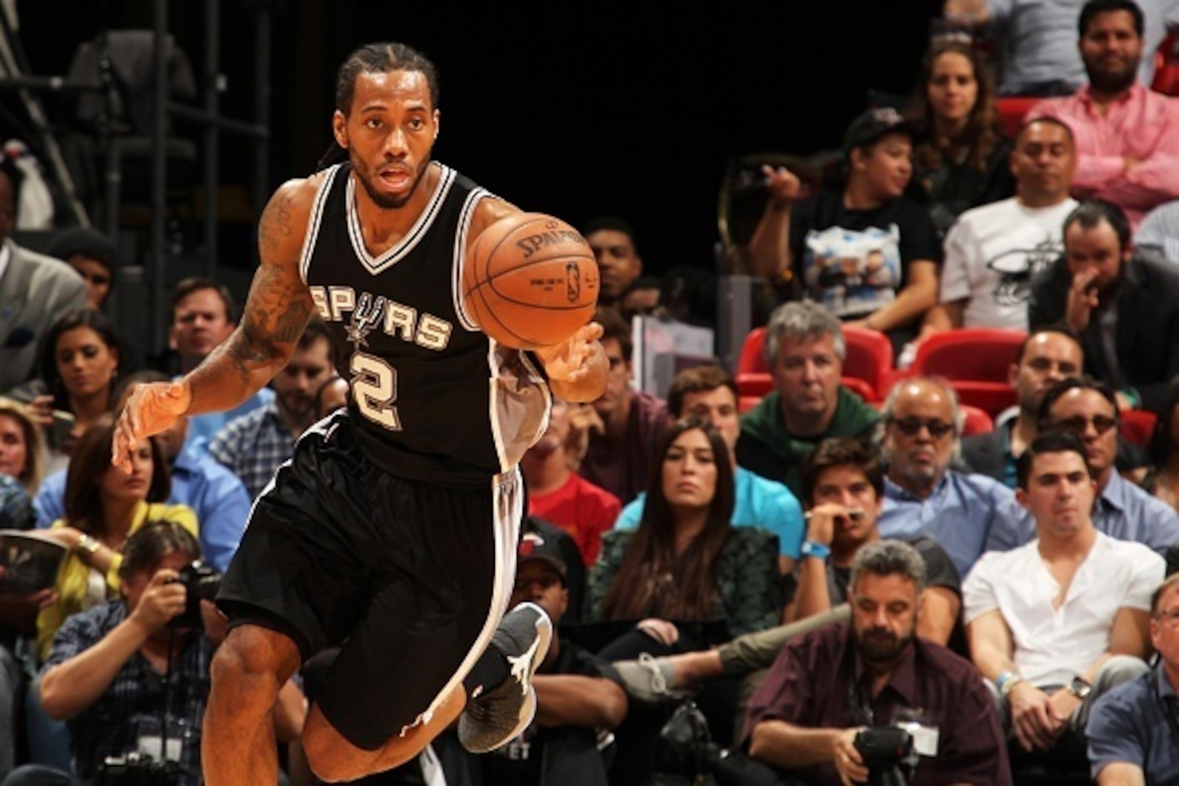 MIAMI, FL - MARCH 31:  Kawhi Leonard #2 of the San Antonio Spurs handles the ball against the Miami Heat on March 31, 2015 at American Airlines Arena in Miami, Florida.  NOTE TO USER: User expressly acknowledges and agrees that, by downloading and or usin