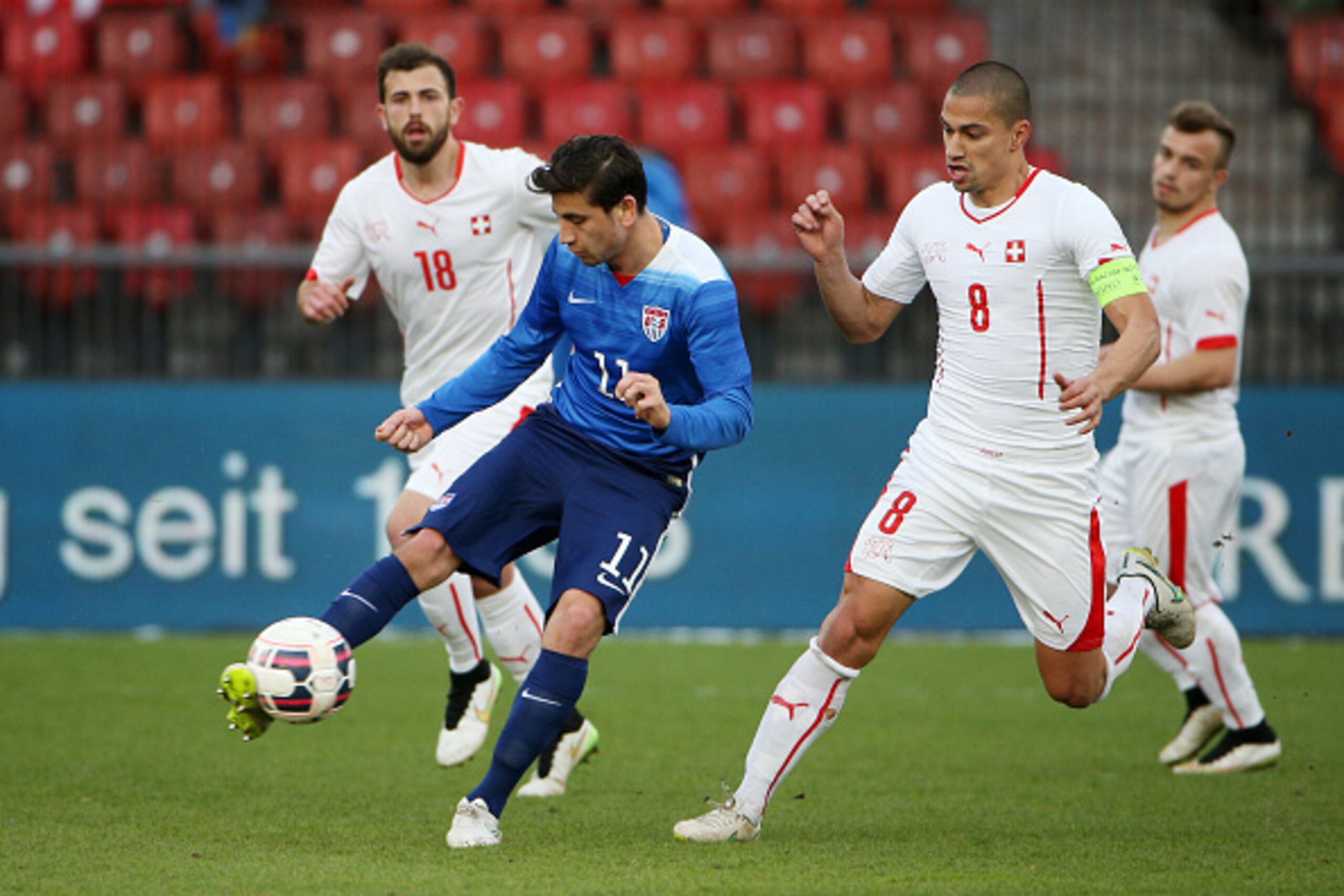 ZURICH, SWITZERLAND - MARCH 31: Alejandro Bedoya of the USA (L) plays the ball under pressure from Goekhan Inler of Switzerland during the international friendly match between Switzerland and the United States at Stadium Letzigrund on March 31, 2015 in Zu ZURICH, SWITZERLAND - MARCH 31: Alejandro Bedoya of the USA (L) plays the ball under pressure from Goekhan Inler of Switzerland during the international friendly match between Switzerland and the United States at Stadium Letzigrund on March 31, 2015 in Zu