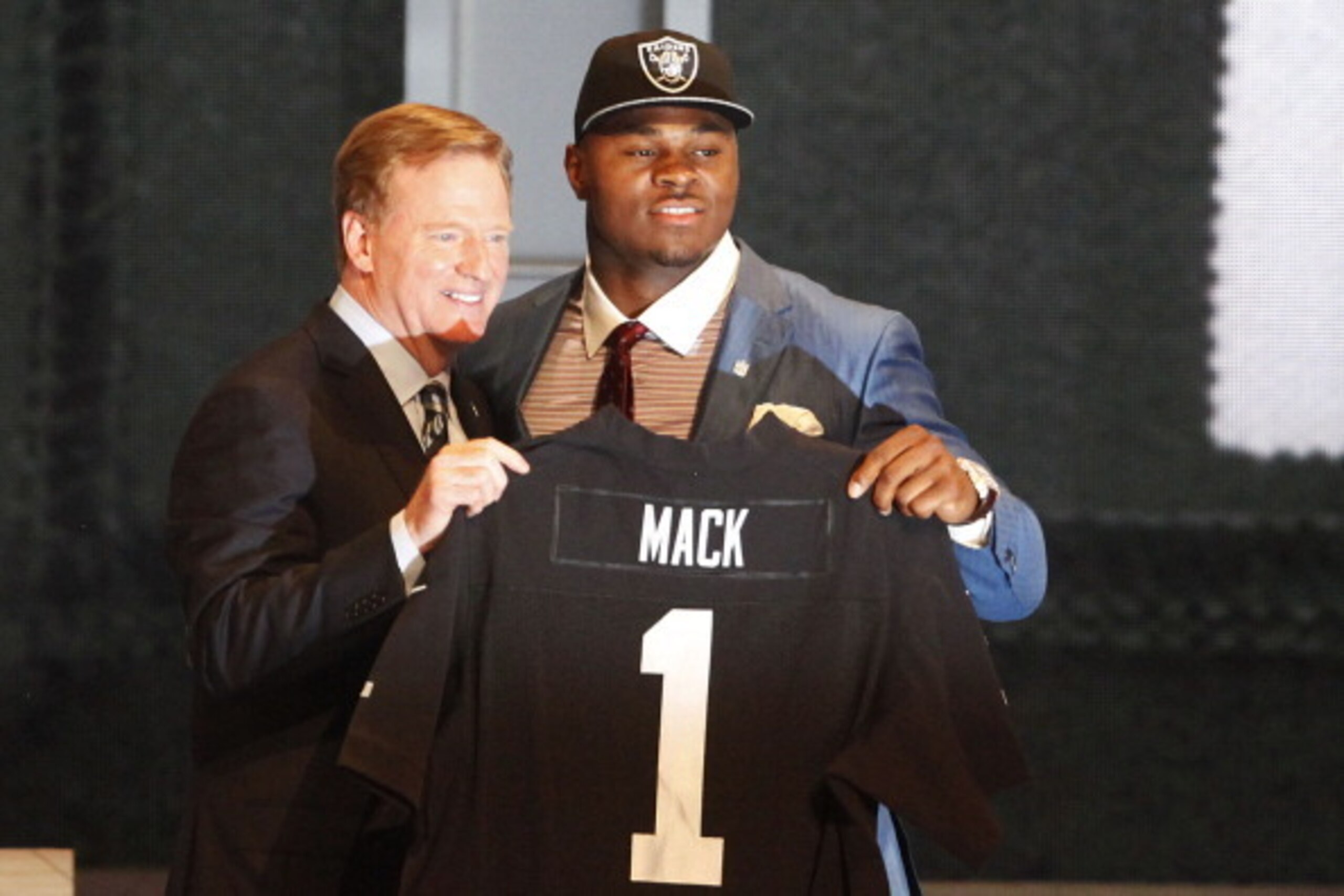 NEW YORK, NY - MAY 08:  Khalil Mack of the Buffalo Bulls poses with NFL Commissioner Roger Goodell after he was picked #5 overall by the Oakland Raiders during the first round of the 2014 NFL Draft at Radio City Music Hall on May 8, 2014 in New York City.