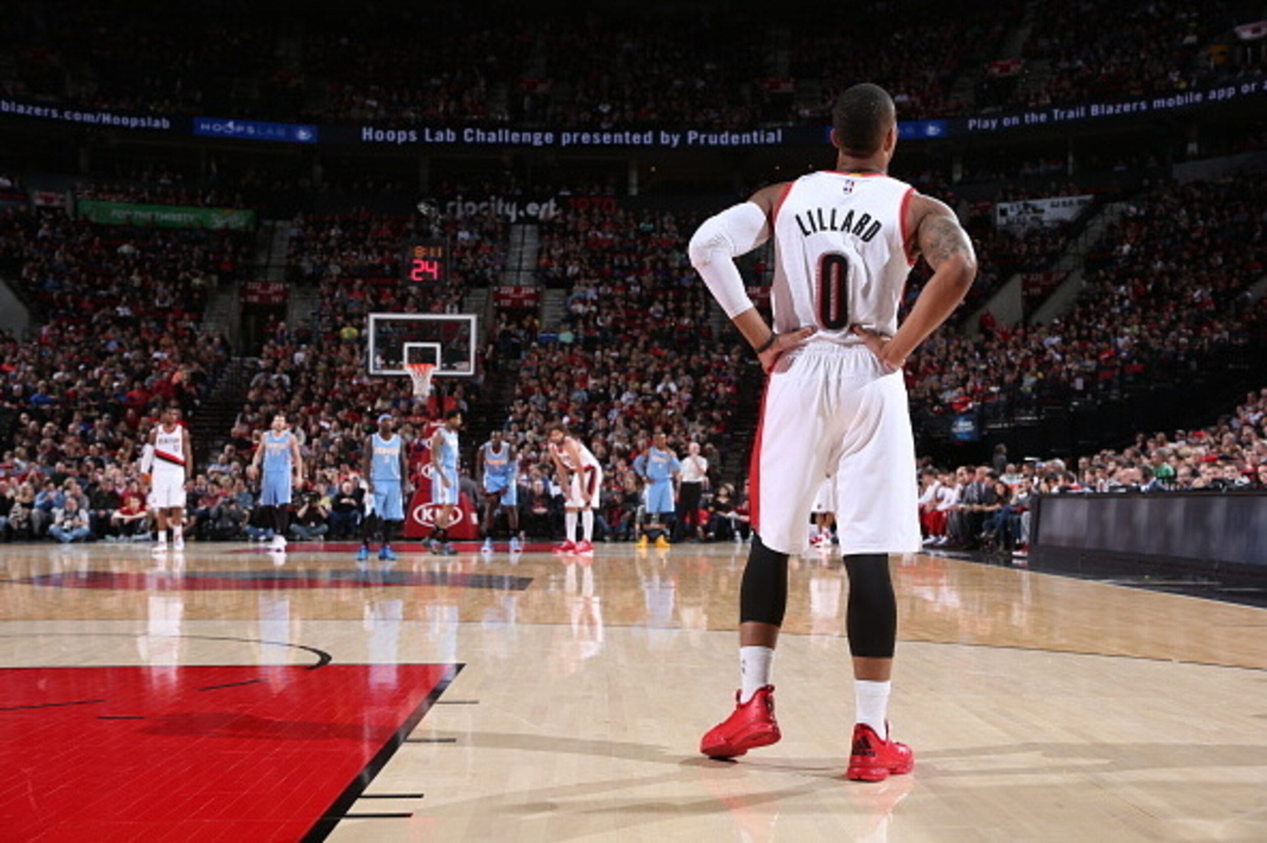 PORTLAND, OR - MARCH 28: Damian Lillard #0 of the Portland Trail Blazers stands on the court during a game against the Denver Nuggets on March 28, 2015 at the Moda Center Arena in Portland, Oregon. NOTE TO USER: User expressly acknowledges and agrees that