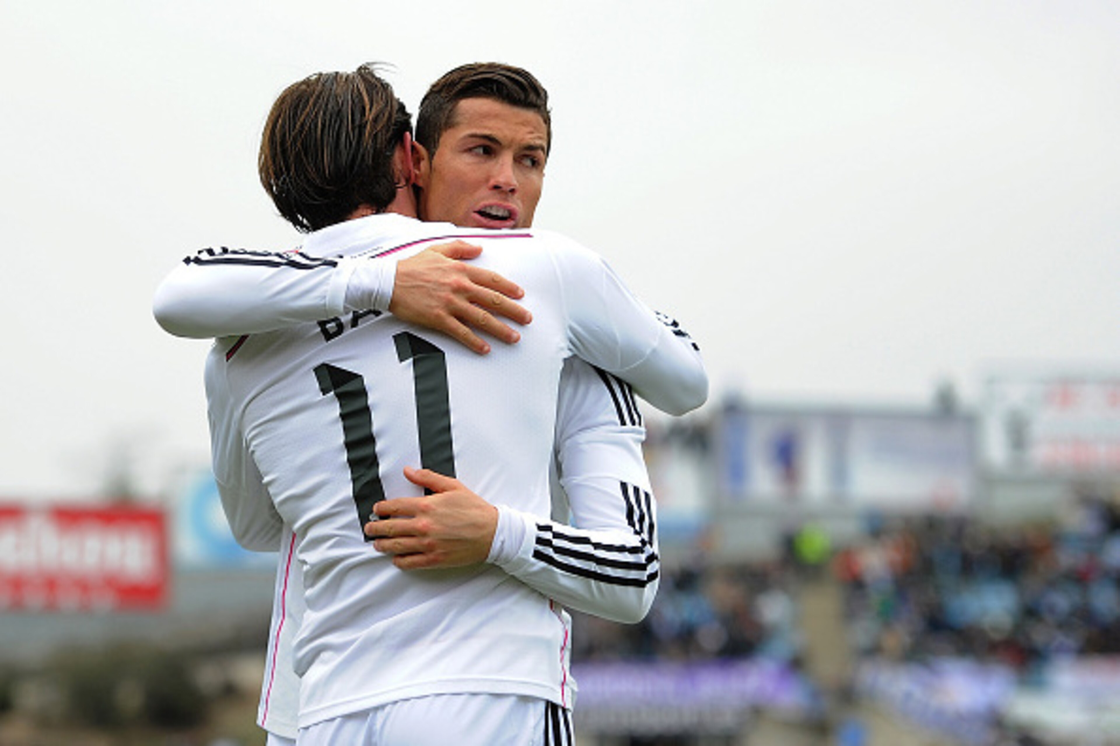 GETAFE, SPAIN - JANUARY 18:  Gareth Bale of Real Madrid celebrates with Cristiano Ronaldo after scoring his team's 2nd goal during the La Liga match between Getafe CF and Real Madrid CF at Coliseum Alfonso Perez stadium on January 18, 2015 in Getafe, Spai