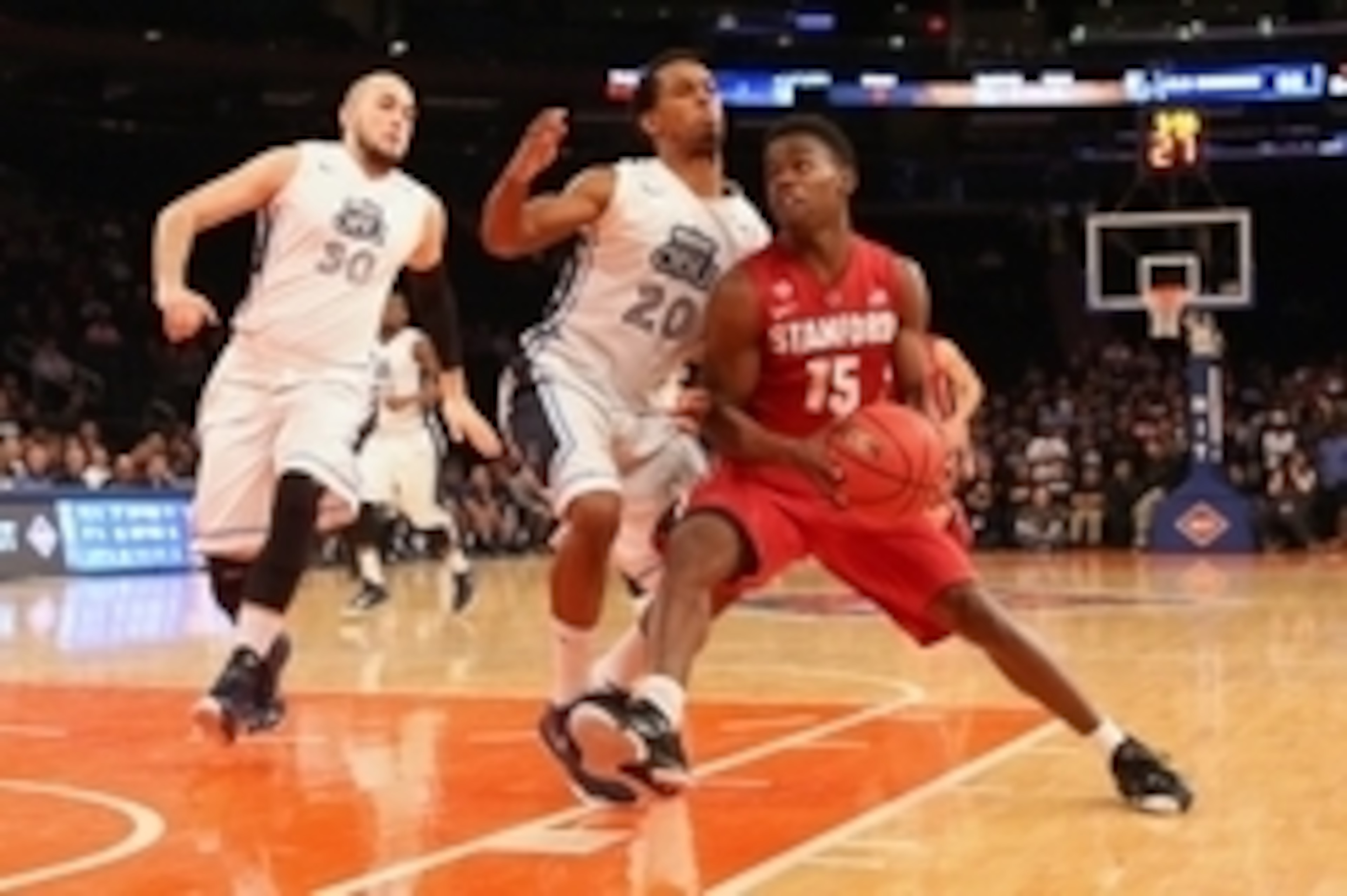 Mar 31, 2015; New York, NY, USA; Stanford Cardinal guard Marcus Allen (15) drives past Old Dominion Monarchs guard Trey Freeman (20) during the second half in the semifinals of the 2015 NIT college basketball tournament at Madison Square Garden. Stanford 