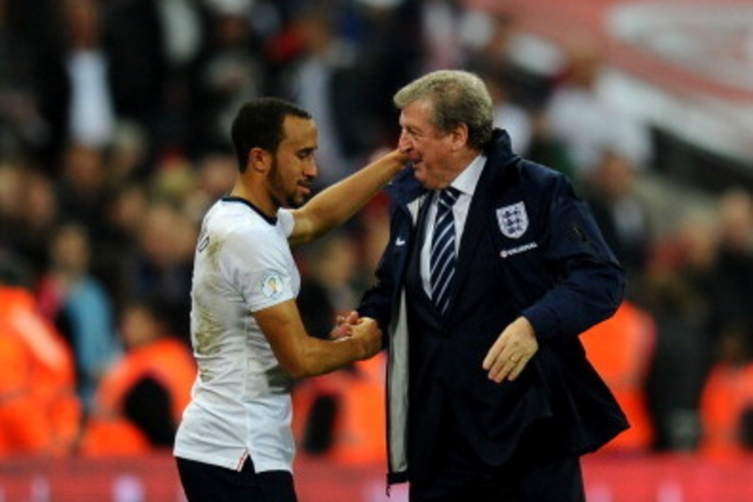 LONDON, ENGLAND - OCTOBER 15:  England manager Roy Hodgson shakes hands with Andros Townsend of England as they qualify for the World Cup in Brazil after the FIFA 2014 World Cup Qualifying Group H match between England and Poland at Wembley Stadium on Oct