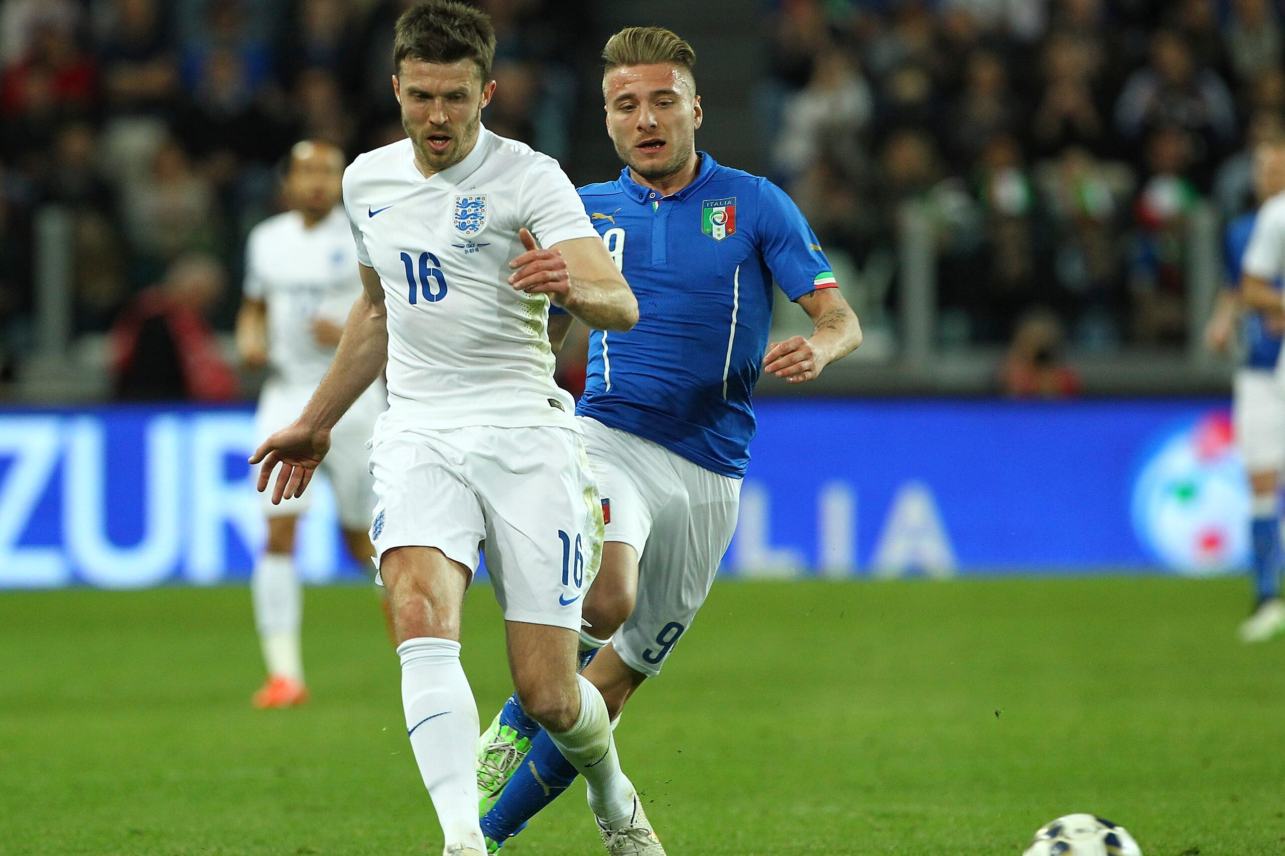 TURIN, ITALY - MARCH 31:  Michael Carrick of England is challenged by Ciro Immobile of Italy during the international friendly match between Italy and England at Juventus Arena on March 31, 2015 in Turin, Italy.  (Photo by Marco Luzzani/Getty Images)