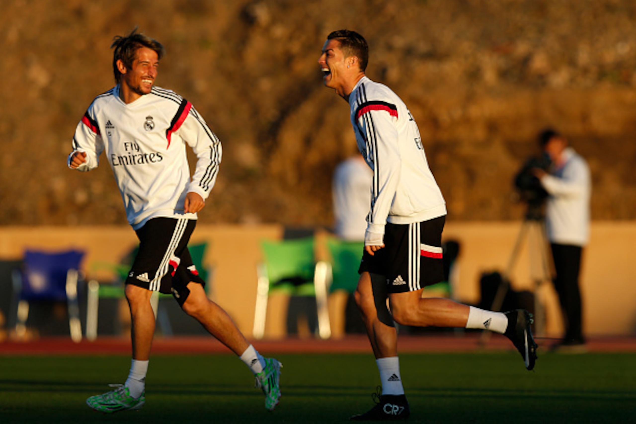 MARRAKECH, MOROCCO - DECEMBER 19: Cristiano Ronaldo of Real Madrid enjoys a joke with Fabio Coentrao during a training session at Le Grande Stade de Marrakech on December 19, 2014 in Marrakech, Morocco.  (Photo by Steve Bardens/Getty Images)