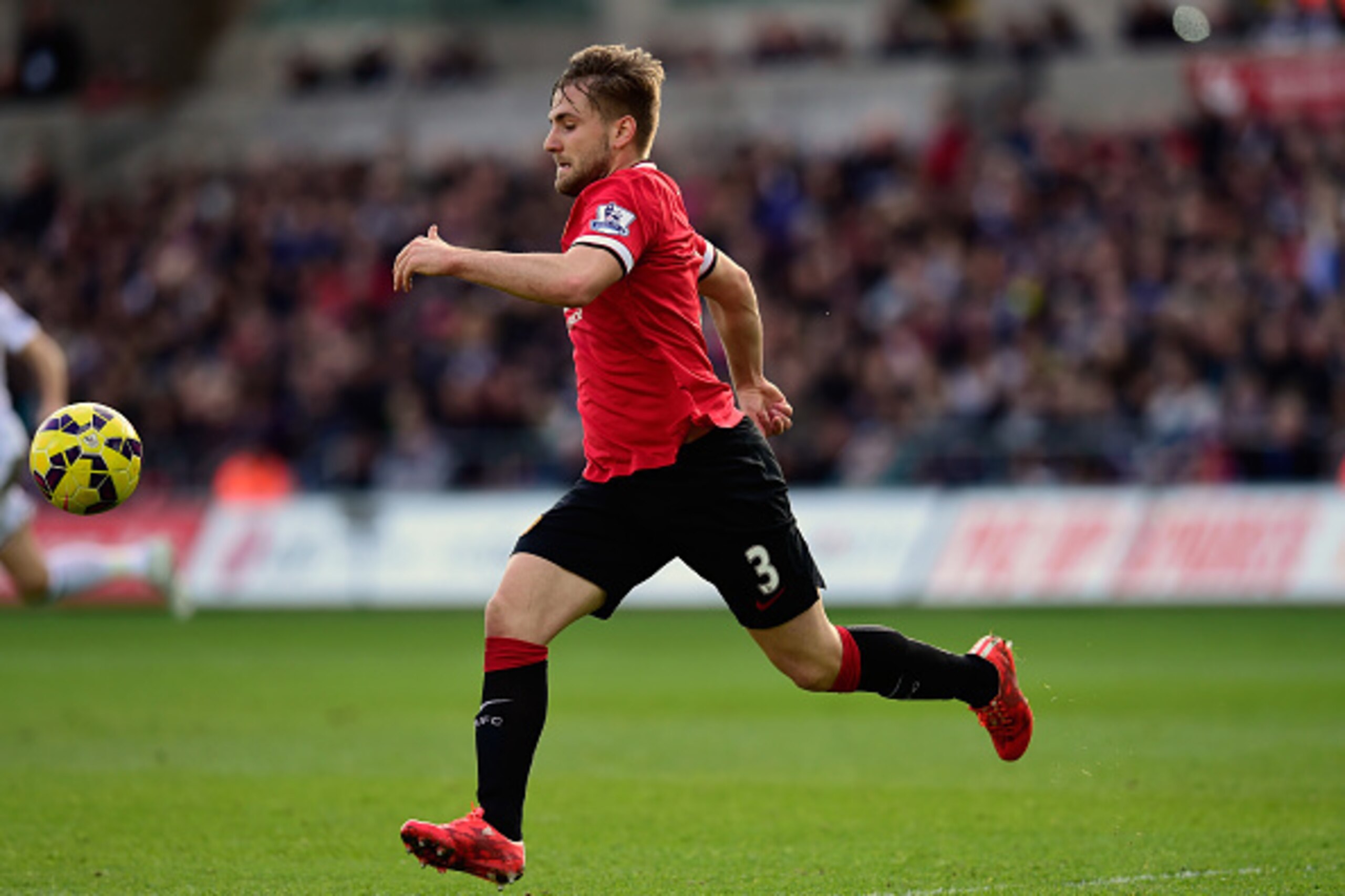 SWANSEA, WALES - FEBRUARY 21: Luke Shaw of Manchester United in action during the Barclays Premier League match between Swansea City and Manchester United at Liberty Stadium on February 21, 2015 in Swansea, Wales.  (Photo by Stu Forster/Getty Images)