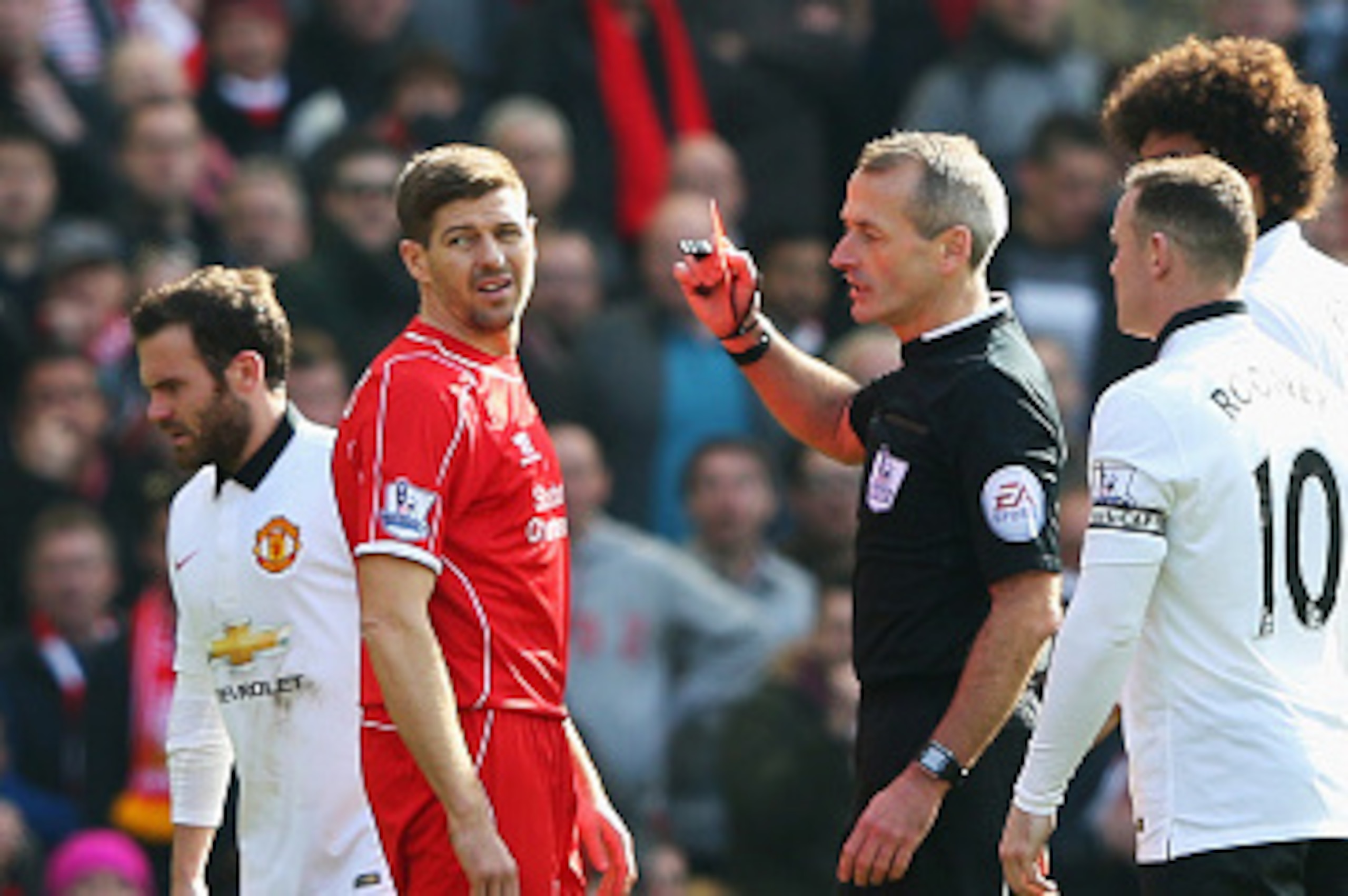 LIVERPOOL, ENGLAND - MARCH 22: Steven Gerrard of Liverpool is shown the red card by referee Martin Atkinson during the Barclays Premier League match between Liverpool and Manchester United at Anfield on March 22, 2015 in Liverpool, England.  (Photo by Ale