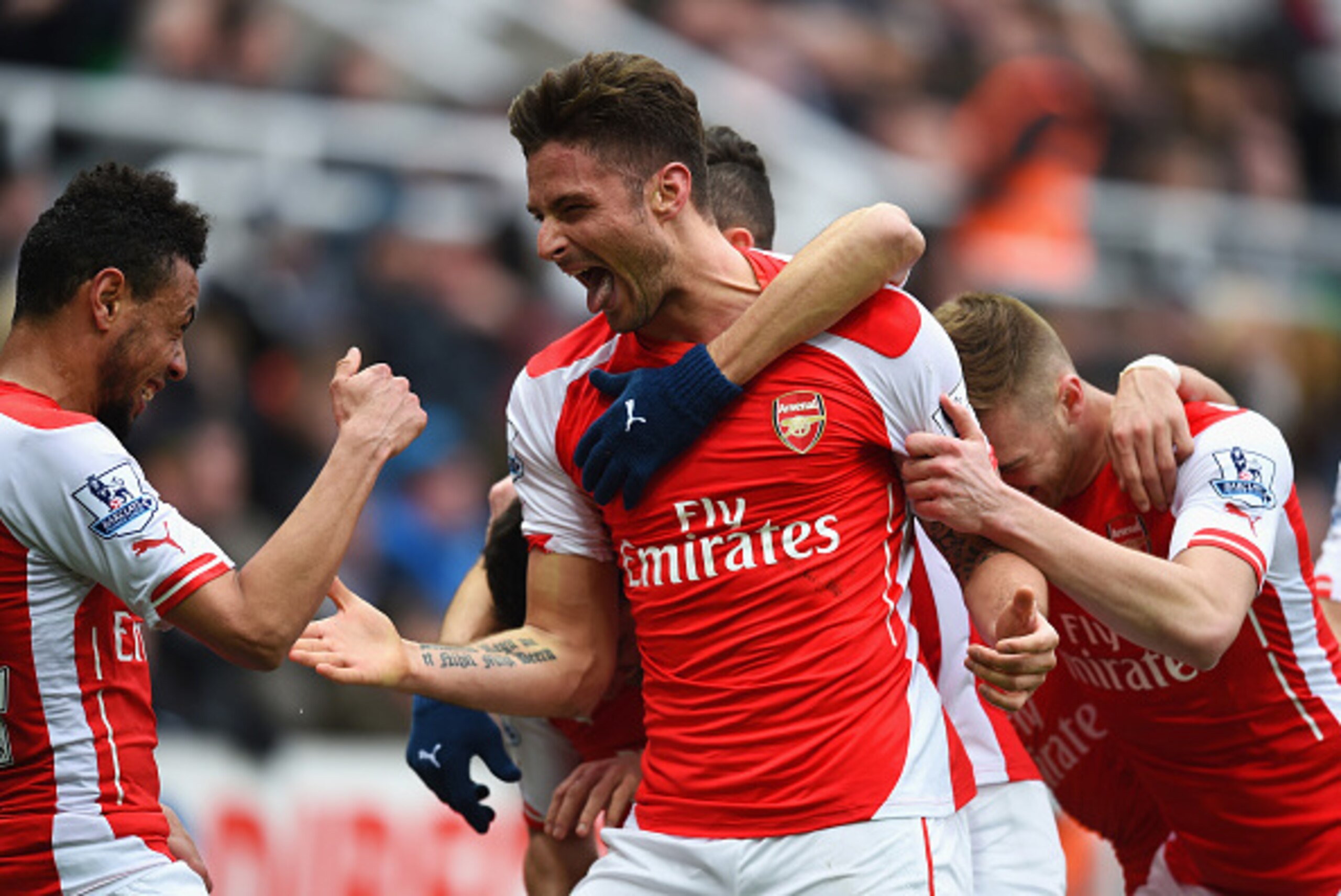 NEWCASTLE UPON TYNE, ENGLAND - MARCH 21:  Olivier Giroud of Arsenal celebrates scoring his second goal with Francis Coquelin during the Barclays Premier League match between Newcastle United and Arsenal at St James' Park on March 21, 2015 in Newcastle upo