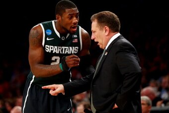 NEW YORK, NY - MARCH 28:  Head coach Tom Izzo of the Michigan State Spartans talks with Branden Dawson #22 against the Virginia Cavaliers during the regional semifinal of the 2014 NCAA Men's Basketball Tournament at Madison Square Garden on March 28, 2014