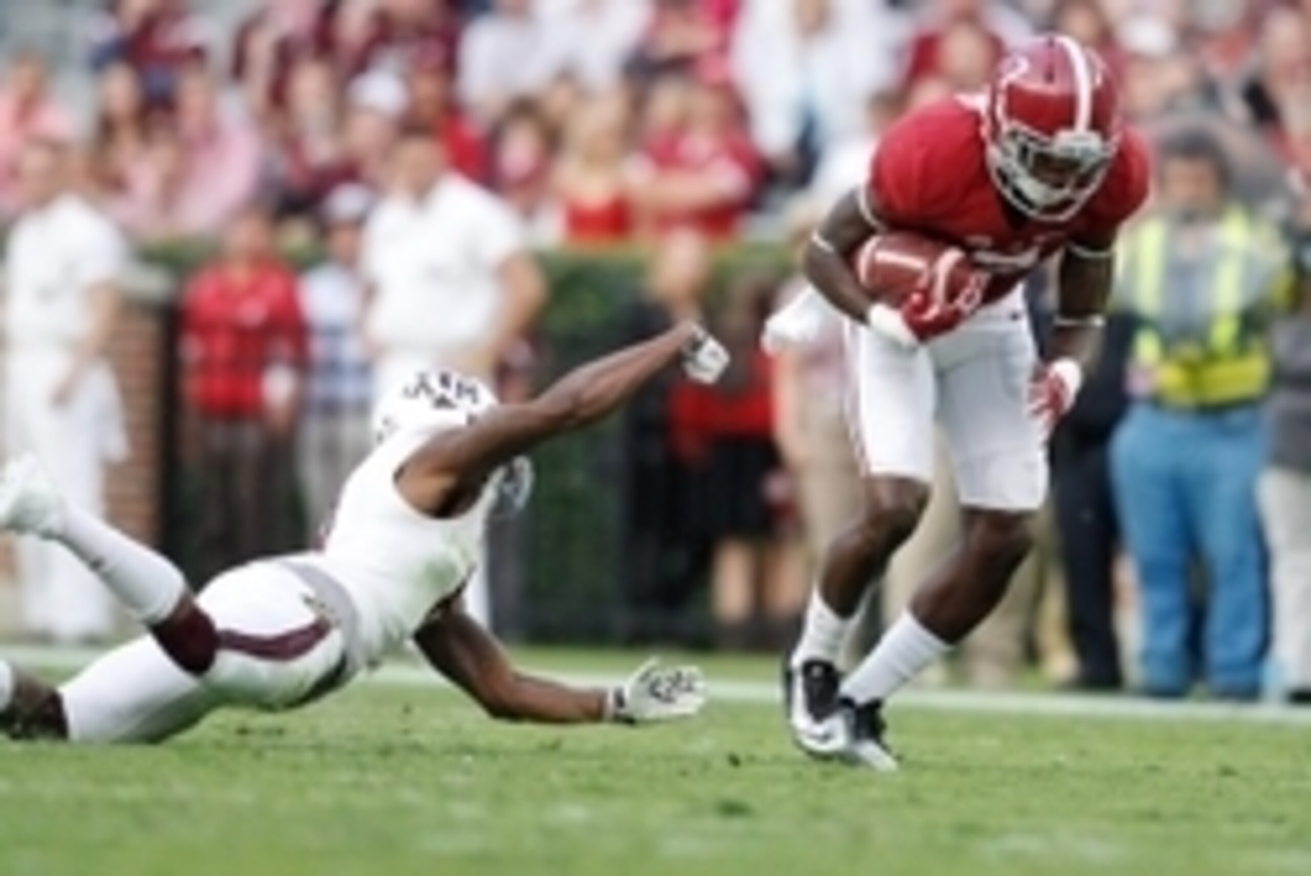 Oct 18, 2014; Tuscaloosa, AL, USA; Alabama Crimson Tide wide receiver Cam Sims (7) gets away from Texas A&M Aggies defensive back Nick Harvey (8) at Bryant-Denny Stadium. The Crimson Tide defeated the Aggies 59-0. Mandatory Credit: Marvin Gentry-USA TODAY Oct 18, 2014; Tuscaloosa, AL, USA; Alabama Crimson Tide wide receiver Cam Sims (7) gets away from Texas A&M Aggies defensive back Nick Harvey (8) at Bryant-Denny Stadium. The Crimson Tide defeated the Aggies 59-0. Mandatory Credit: Marvin Gentry-USA TODAY