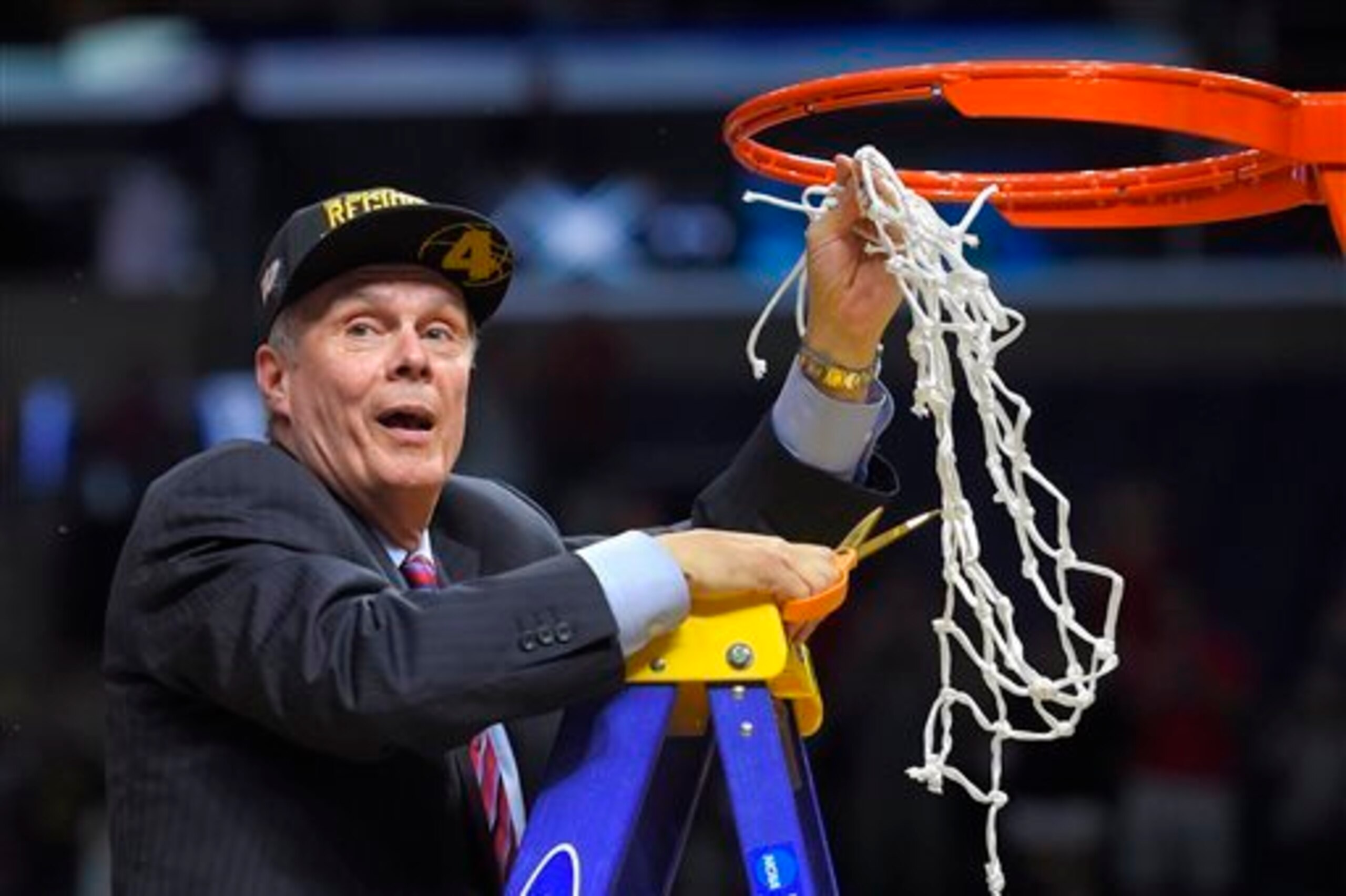 Ryan cuts down the net following Wisconsin's 85-78 victory over Arizona in the Elite Eight.