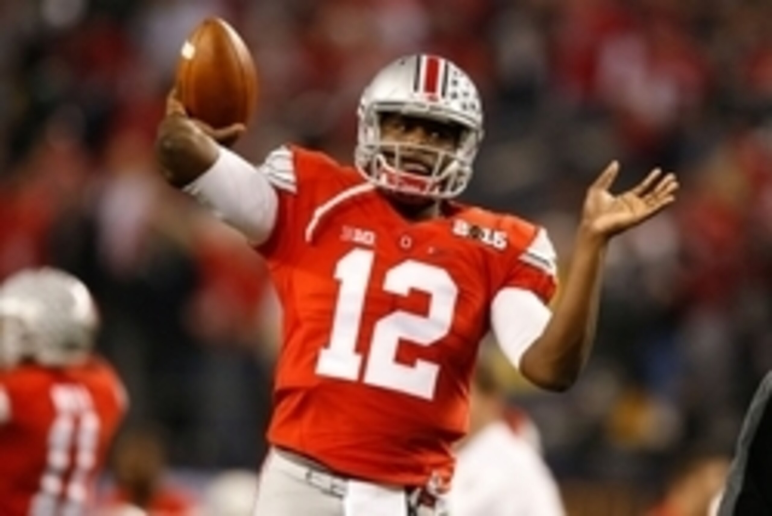 Jan 12, 2015; Arlington, TX, USA; Ohio State Buckeyes quarterback Cardale Jones (12) throws the ball in warmups before the game against the Oregon Ducks in the 2015 CFP National Championship Game at AT&T Stadium. Ohio State won 42-20. Mandatory Credit: Ti