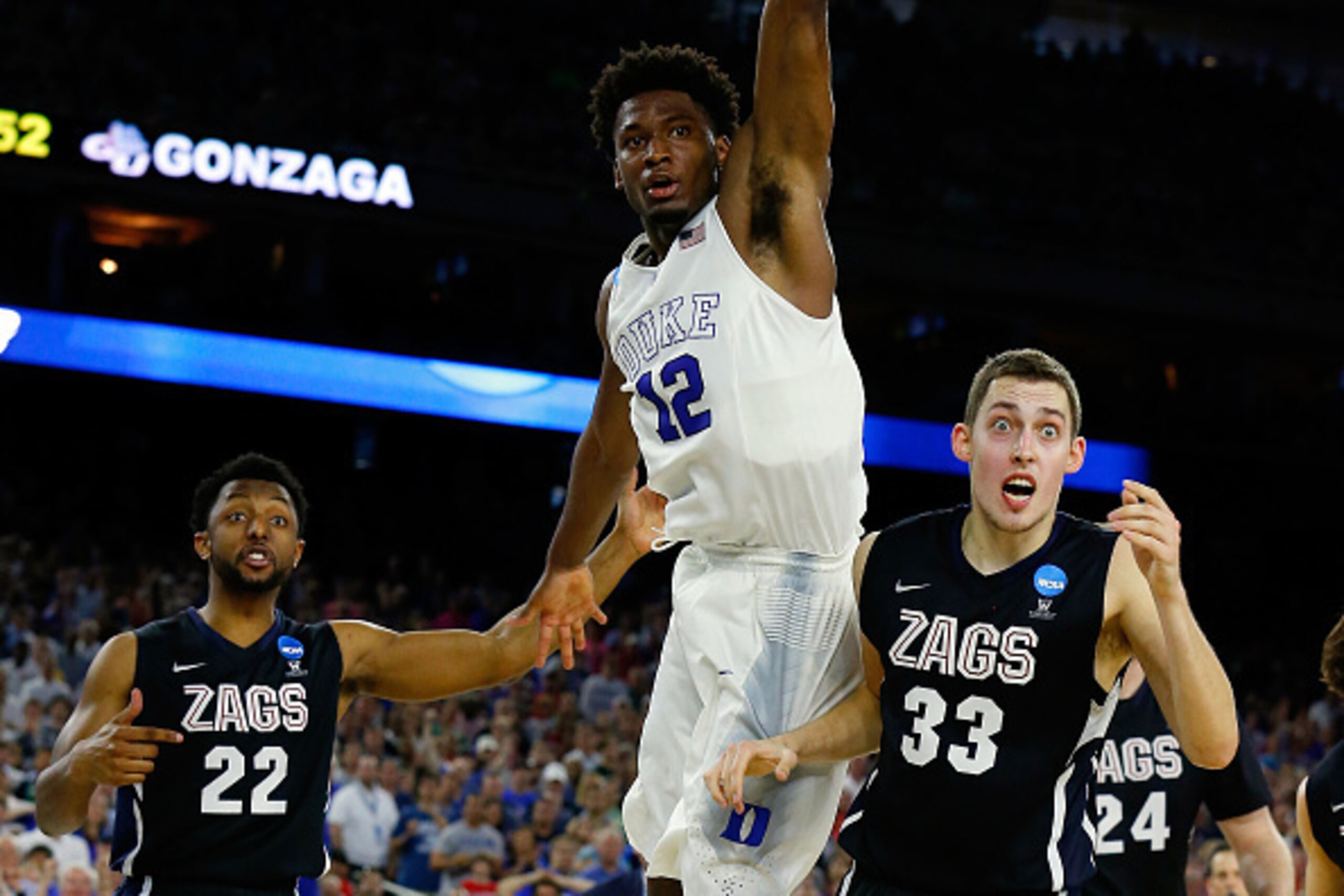 HOUSTON, TX - MARCH 29:  Justise Winslow #12 of the Duke Blue Devils and Kyle Wiltjer #33 of the Gonzaga Bulldogs react to an out of bounds ball during the South Regional Final of the 2015 NCAA Men's Basketball Tournament at NRG Stadium on March 29, 2015 