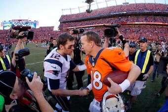 DENVER, CO - JANUARY 19:  Tom Brady #12 of the New England Patriots congratulates  Peyton Manning #18 of the Denver Broncos after the Broncos defeated the Patriots 26 to 16 during the AFC Championship game at Sports Authority Field at Mile High on January