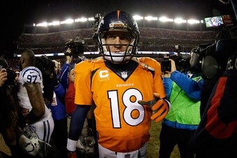 DENVER, CO - JANUARY 11: Peyton Manning #18 of the Denver Broncos walks off the field after losing 24-13 to the Indianapolis Colts in a 2015 AFC Divisional Playoff game at Sports Authority Field at Mile High on January 11, 2015 in Denver, Colorado.  (Phot