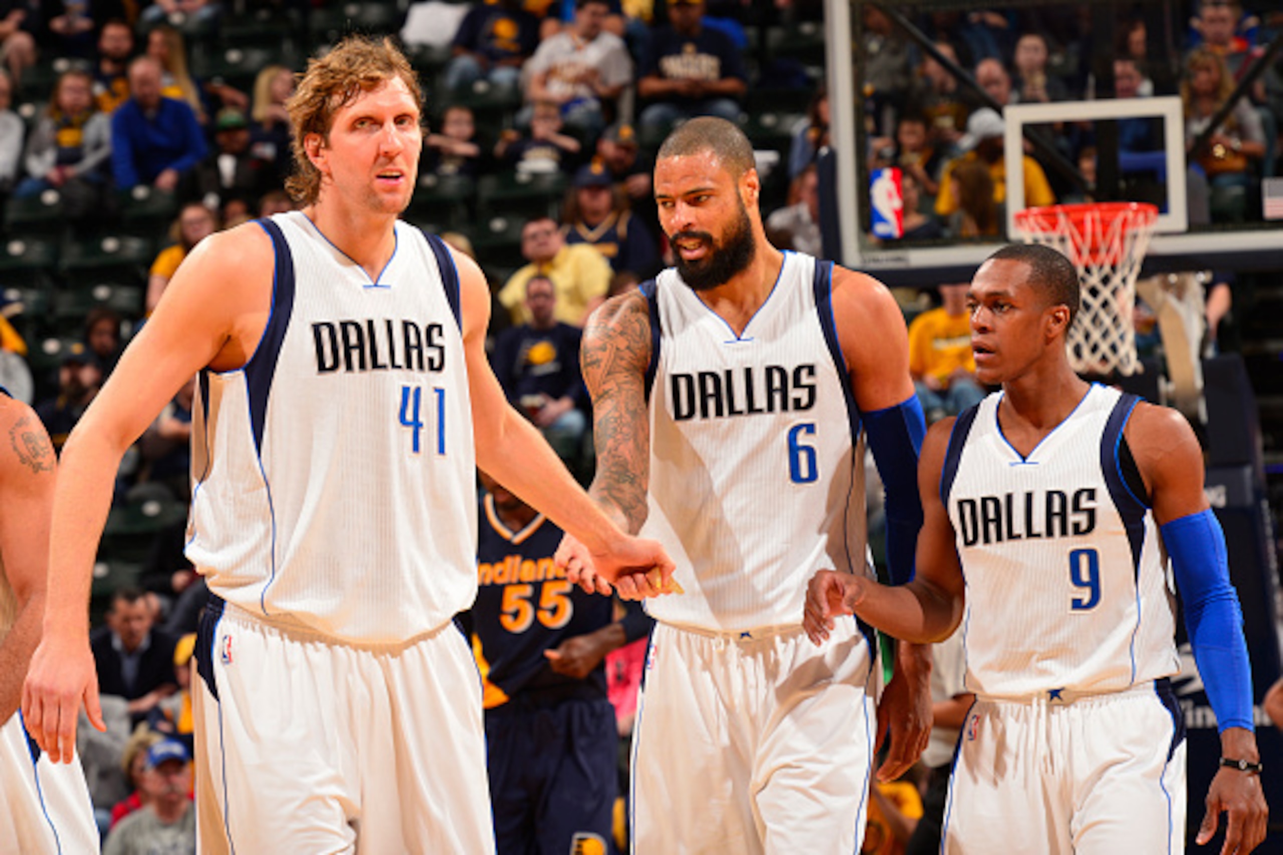 ¬INDIANAPOLIS, IN - MARCH 29: Dirk Nowitzki #41, Tyson Chandler #6 and Rajon Rondo #9 of the Dallas Mavericks give each other five against the Indiana Pacers on March 29, 2015 at Bankers Life Fieldhouse in Indianapolis, Indiana. NOTE TO USER: User express