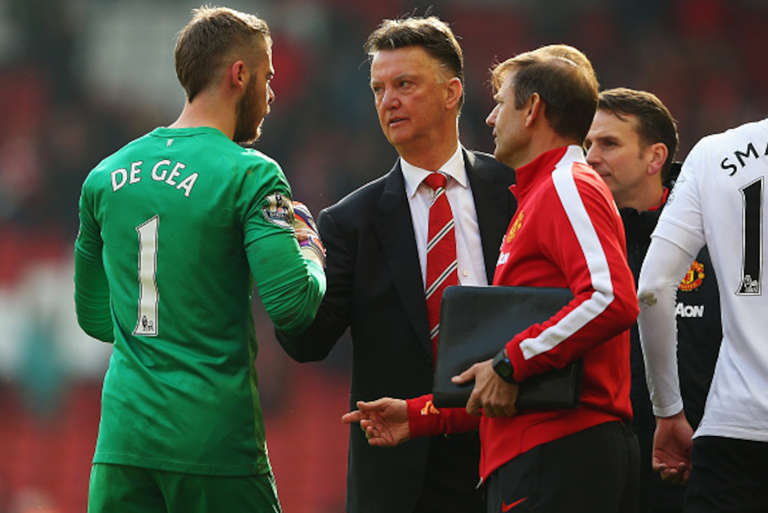 LIVERPOOL, ENGLAND - MARCH 22:  Louis van Gaal, manager of Manchester United celebrates victory with David De Gea of Manchester United after the Barclays Premier League match between Liverpool and Manchester United at Anfield on March 22, 2015 in Liverpoo