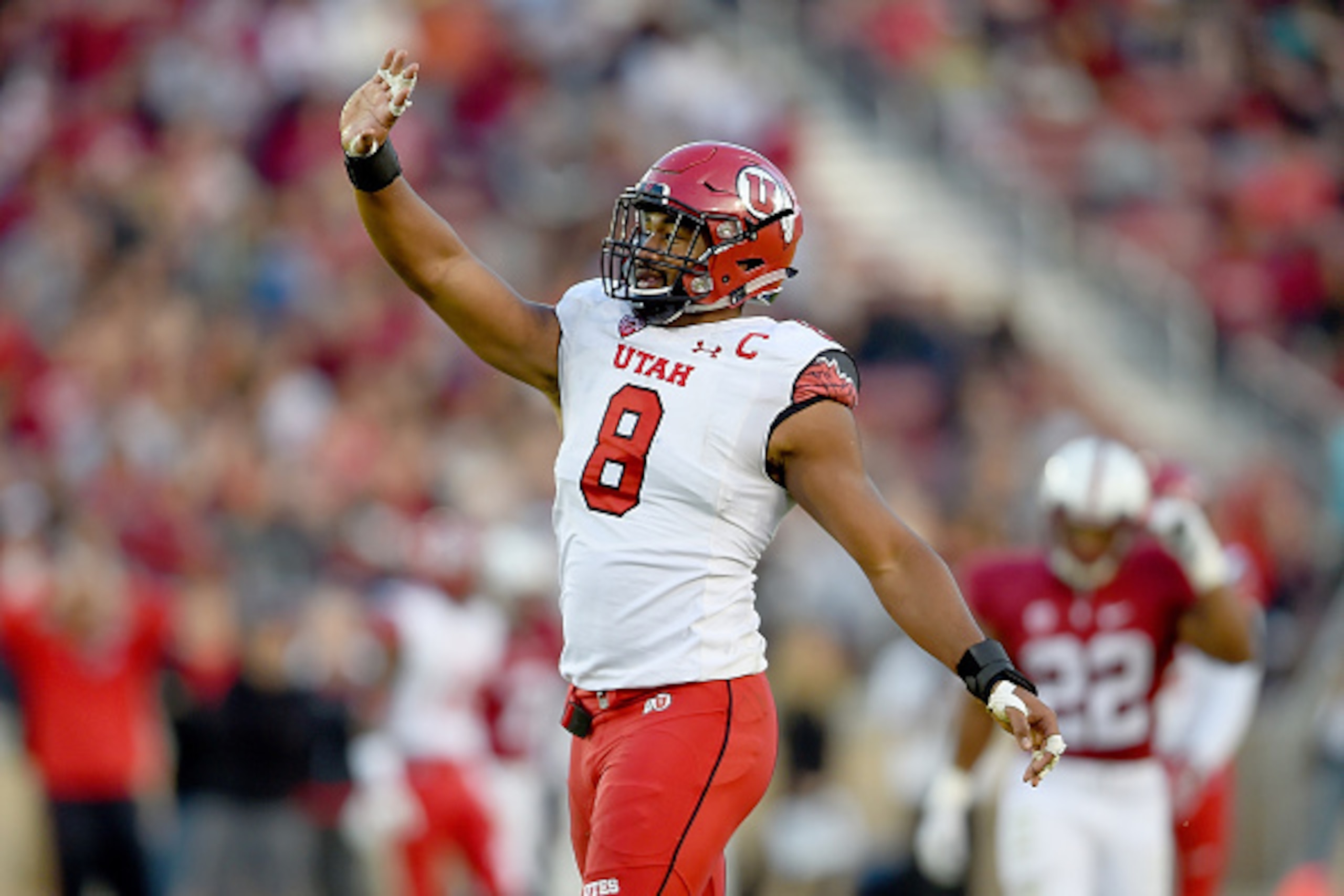 PALO ALTO, CA - NOVEMBER 15:  Nate Orchard #8 of the Utah Utes celebrates after sacking quarterback Kevin Hogan #8 of the Stanford Cardinal in the second quarter at Stanford Stadium on November 15, 2014 in Palo Alto, California.  (Photo by Thearon W. Hend
