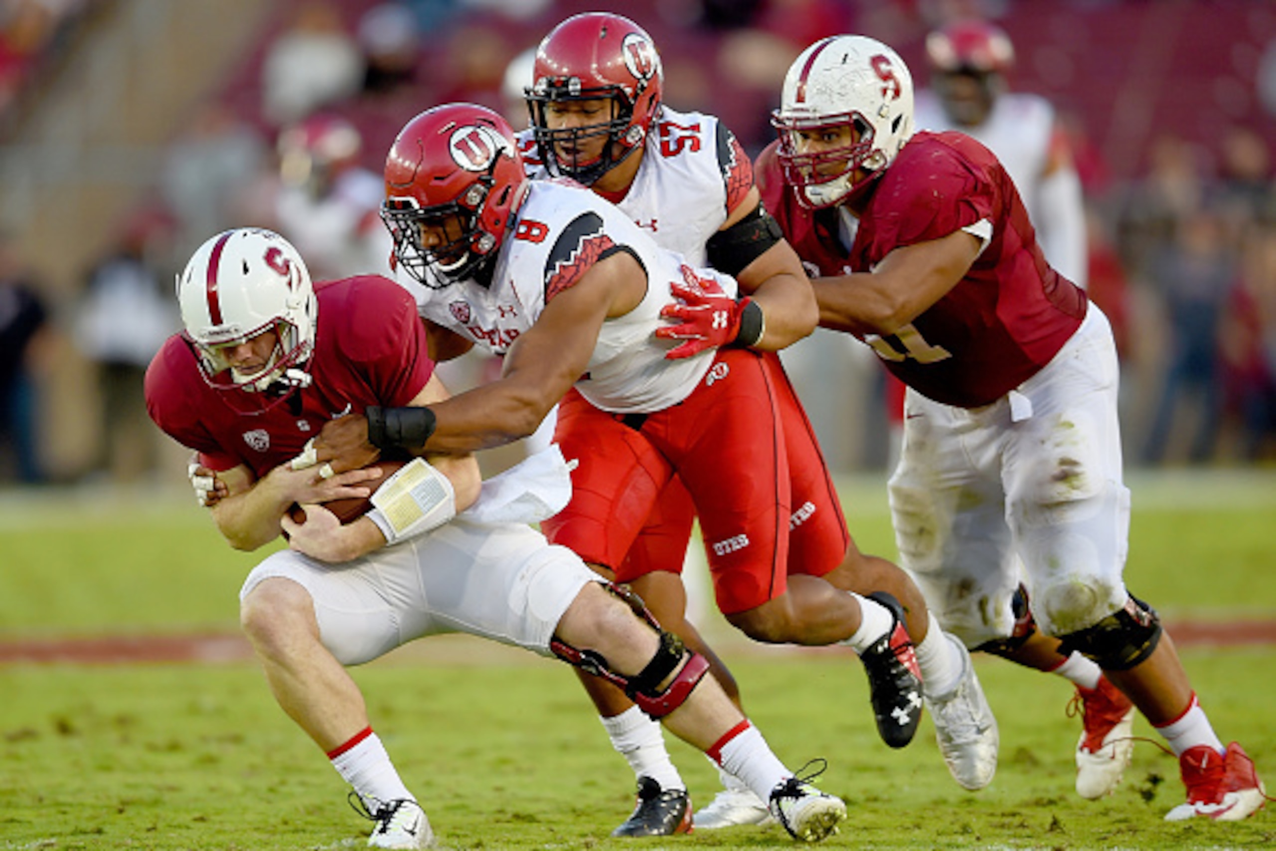 PALO ALTO, CA - NOVEMBER 15:  Nate Orchard #8 of the Utah Utes sacks quarterback Kevin Hogan #8 of the Stanford Cardinal in the second quarter at Stanford Stadium on November 15, 2014 in Palo Alto, California.  (Photo by Thearon W. Henderson/Getty Images)