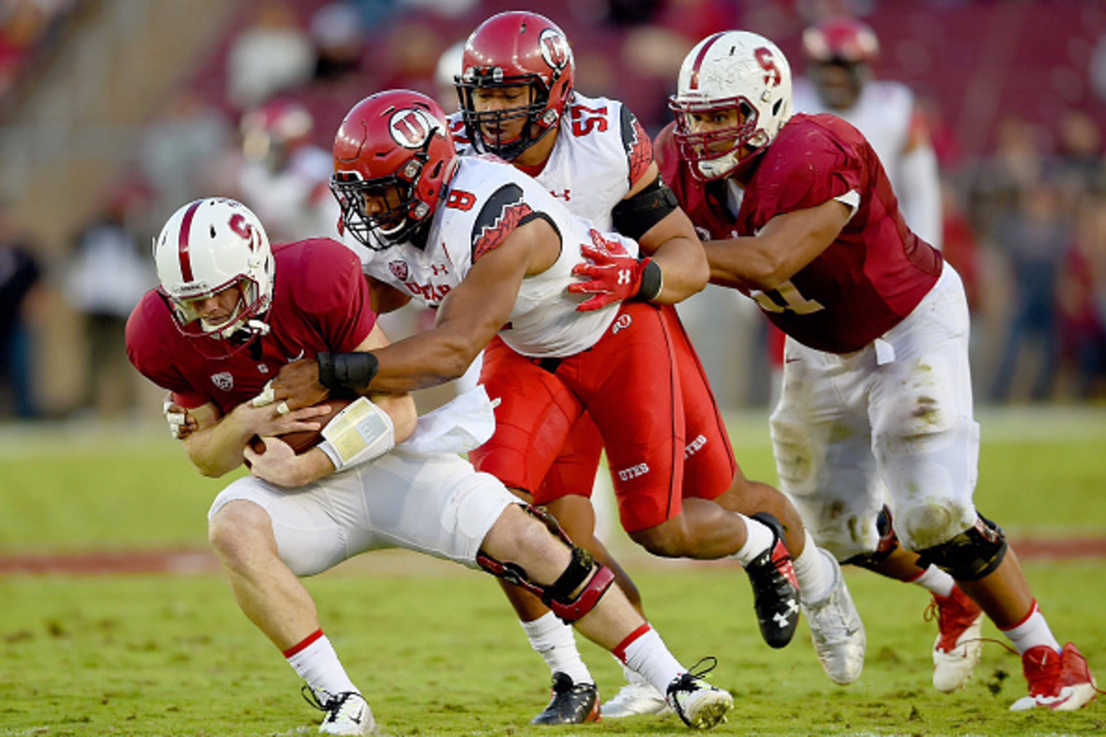 PALO ALTO, CA - NOVEMBER 15:  Nate Orchard #8 of the Utah Utes sacks quarterback Kevin Hogan #8 of the Stanford Cardinal in the second quarter at Stanford Stadium on November 15, 2014 in Palo Alto, California.  (Photo by Thearon W. Henderson/Getty Images)