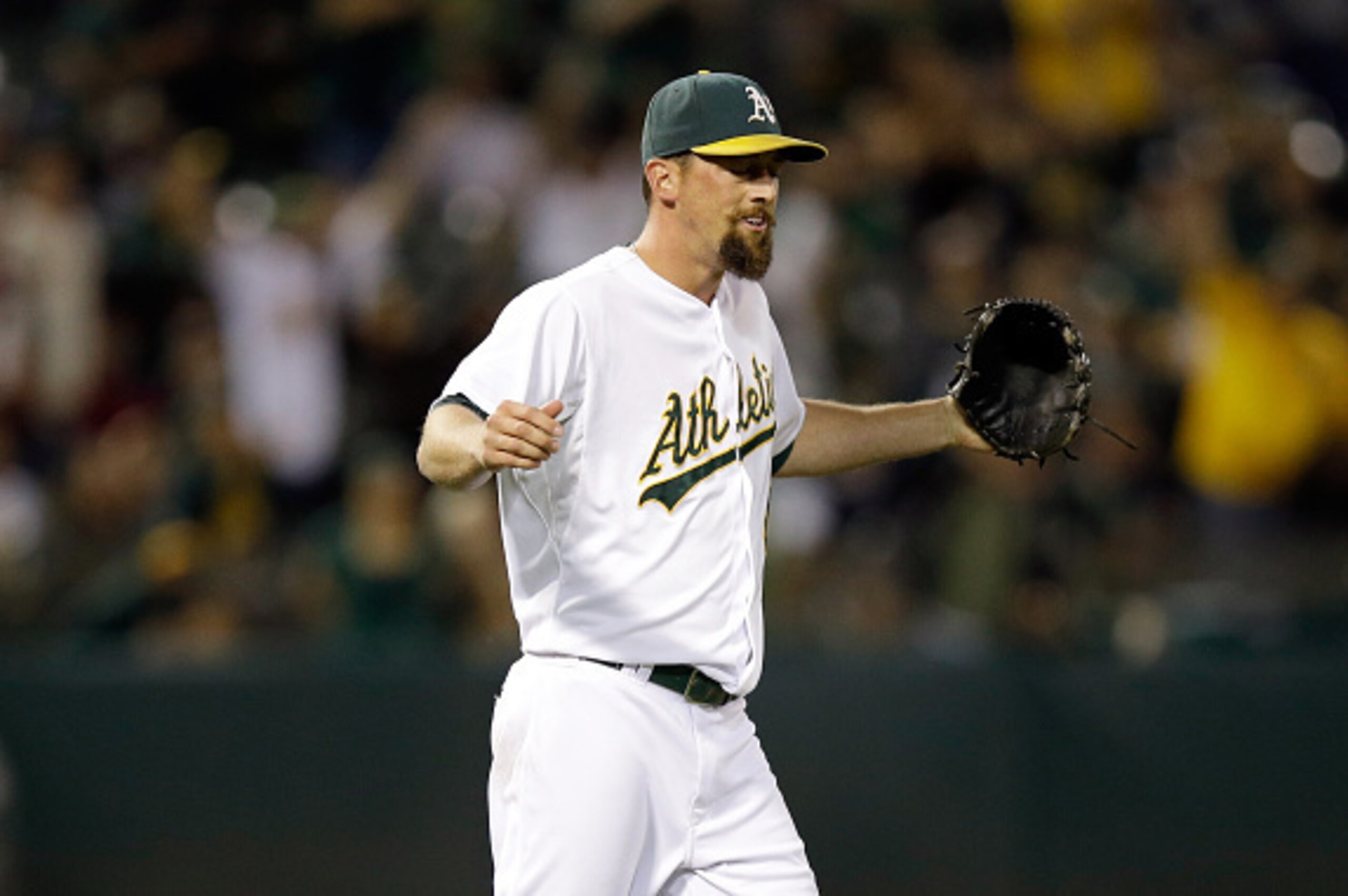 OAKLAND, CA - SEPTEMBER 22:  Luke Gregerson #44 of the Oakland Athletics reacts after the Athletics turned a double play to beat the Los Angeles Angels of Anaheim at O.co Coliseum on September 22, 2014 in Oakland, California.  (Photo by Ezra Shaw/Getty Im