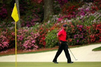 AUGUSTA, GA - APRIL 14:  Tiger Woods of the United States walks across a green during the final round of the 2013 Masters Tournament at Augusta National Golf Club on April 14, 2013 in Augusta, Georgia.  (Photo by Andrew Redington/Getty Images)