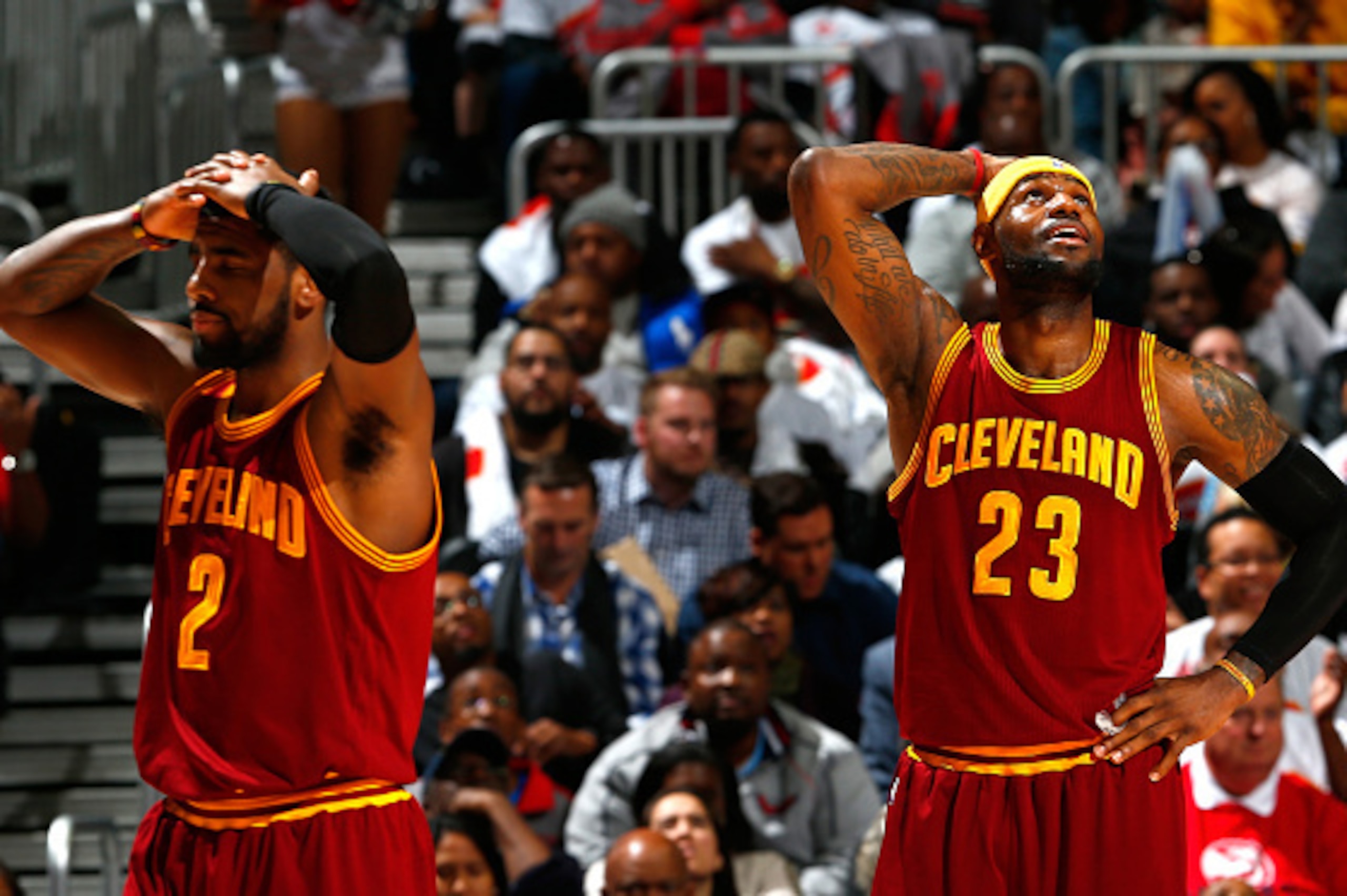ATLANTA, GA - MARCH 06:  LeBron James #23 and Kyrie Irving #2 of the Cleveland Cavaliers react after a foul was called on J.R. Smith #5 during the game against the Atlanta Hawks at Philips Arena on March 6, 2015 in Atlanta, Georgia.  NOTE TO USER: User ex
